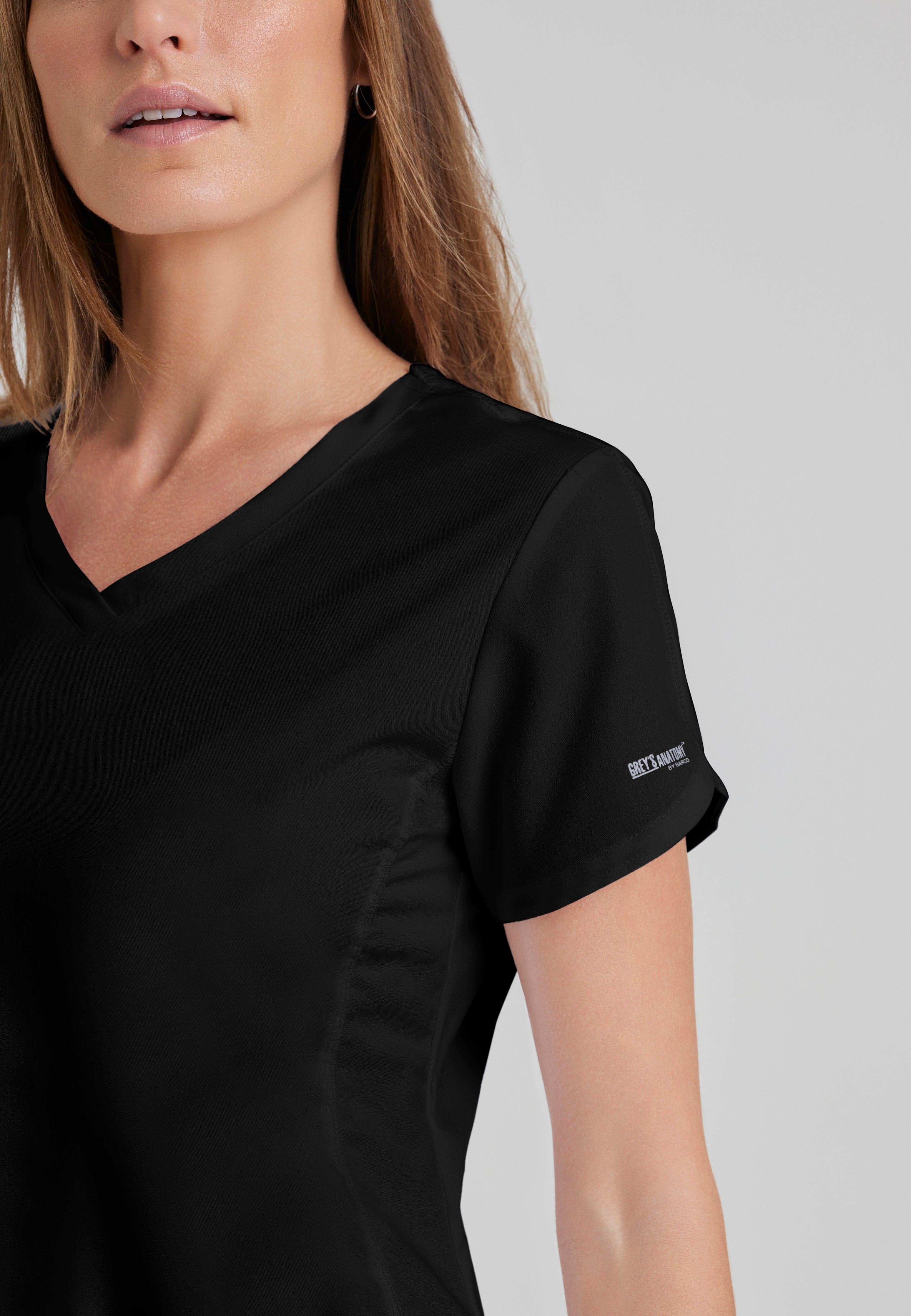 Detail Shot of the Cora 4-Pocket Scrub Top in Black from Grey's Anatomy™ by Barco Classic