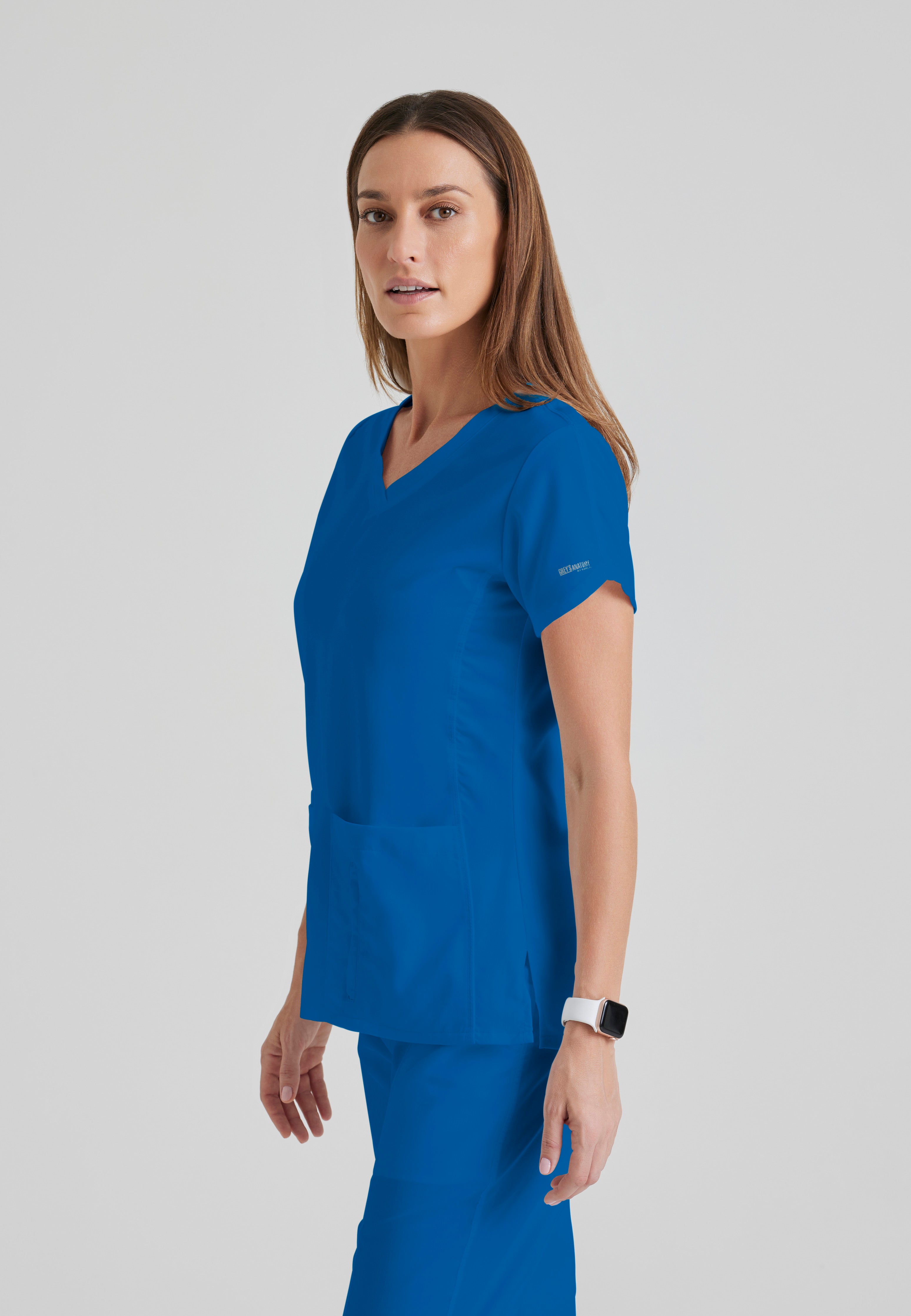 Side View of the Cora 4-Pocket Scrub Top in New Royal from Grey's Anatomy™ by Barco Classic