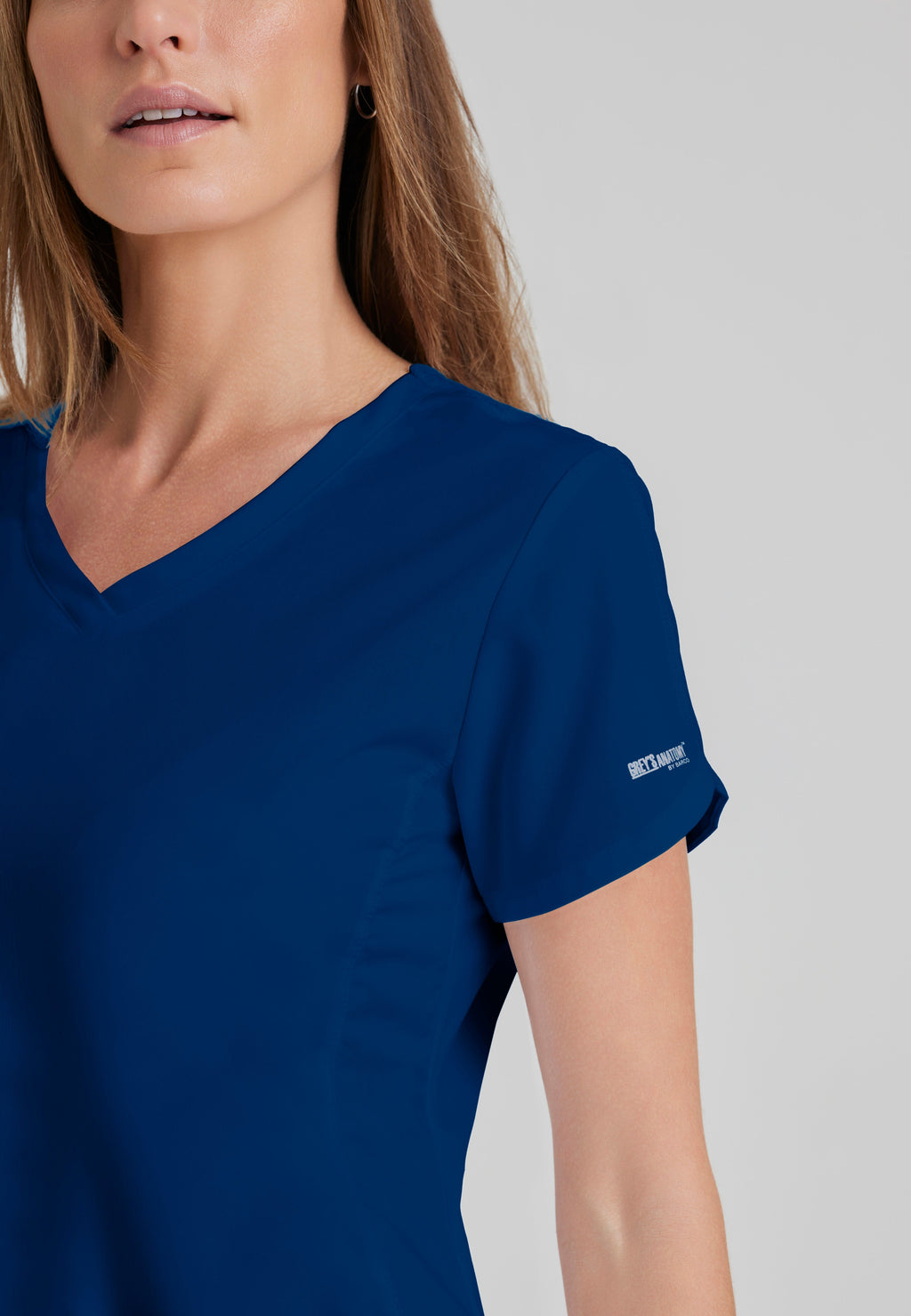 Detail Shot of the Cora 4-Pocket Scrub Top in Indigo from Grey's Anatomy™ by Barco Classic
