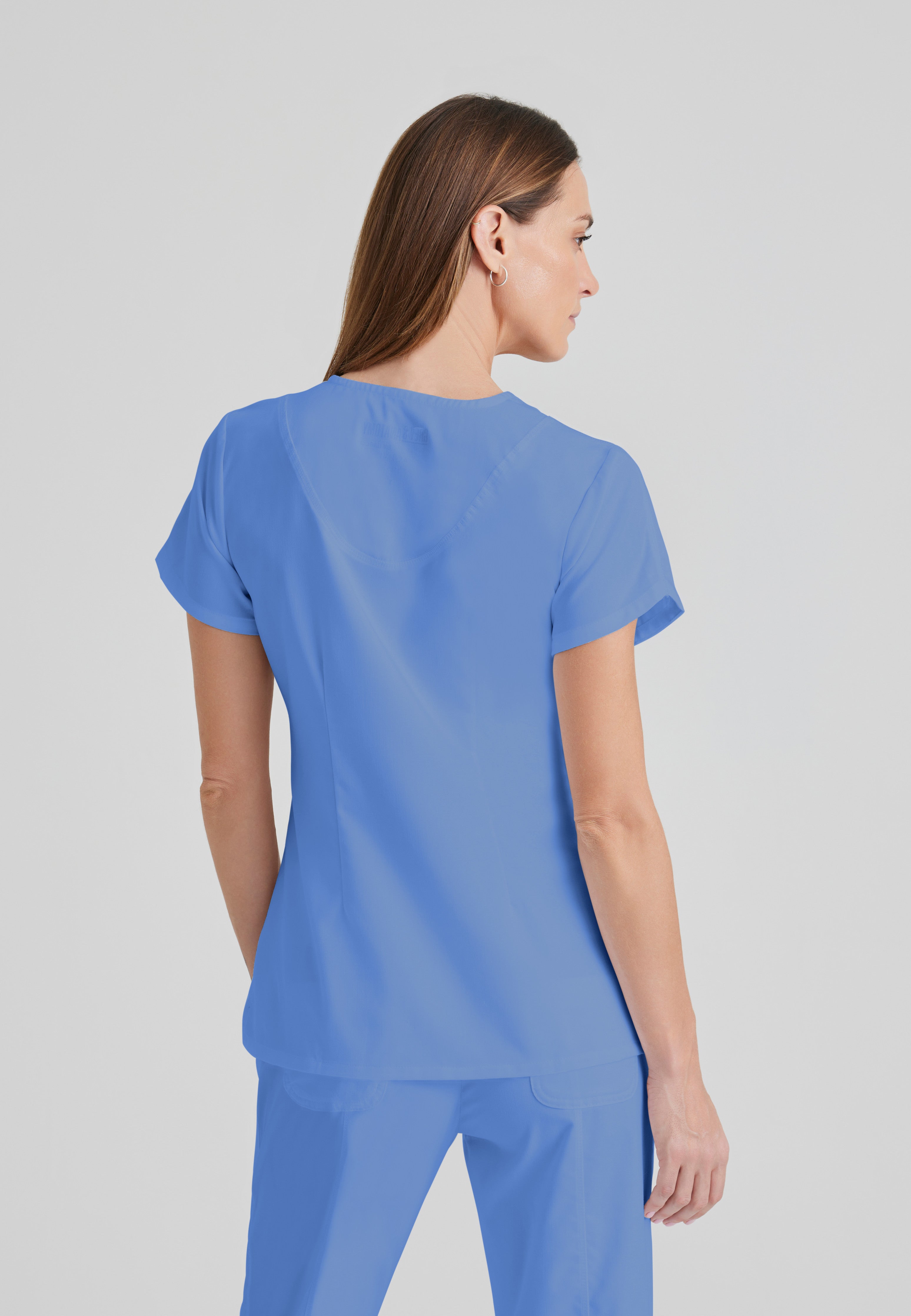 Back View of the Cora 4-Pocket Scrub Top in Ciel Blue from Grey's Anatomy™ by Barco Classic