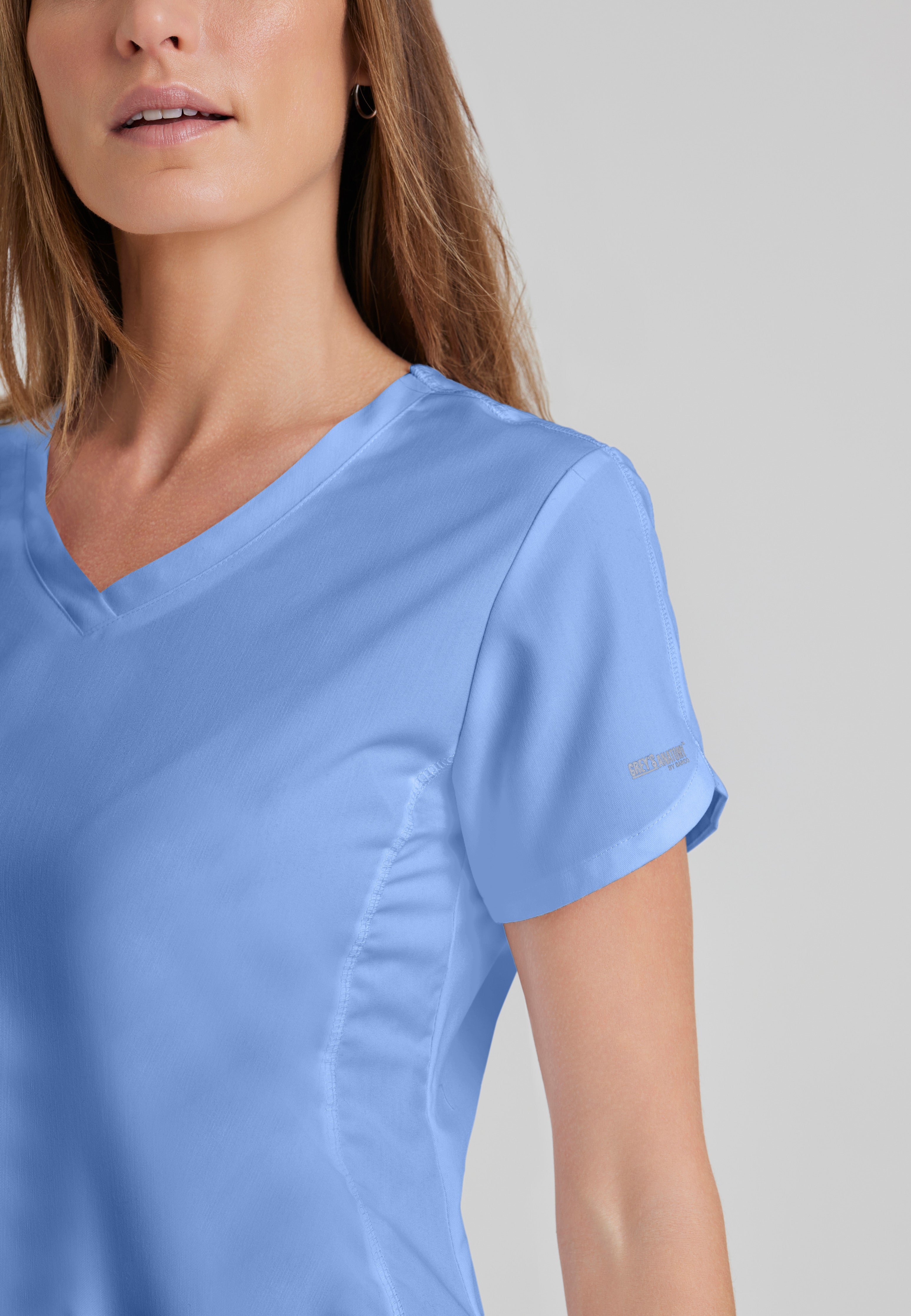 Detail Shot of the Cora 4-Pocket Scrub Top in Ciel Blue from Grey's Anatomy™ by Barco Classic