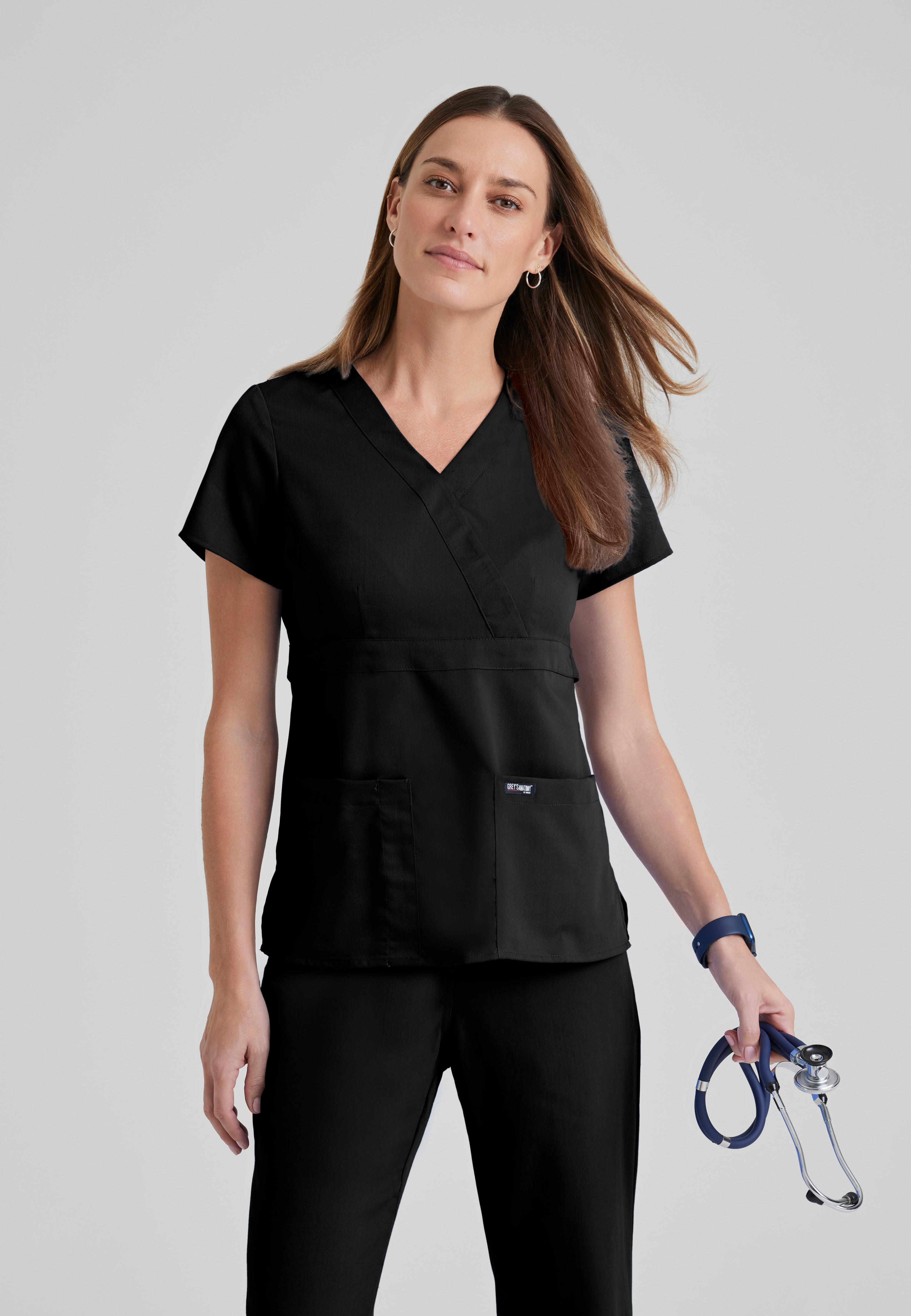 Front View of the Riley 3-Pocket Mock Wrap V-Neck Scrub Top in Black from Grey's Anatomy™ by Barco Classic