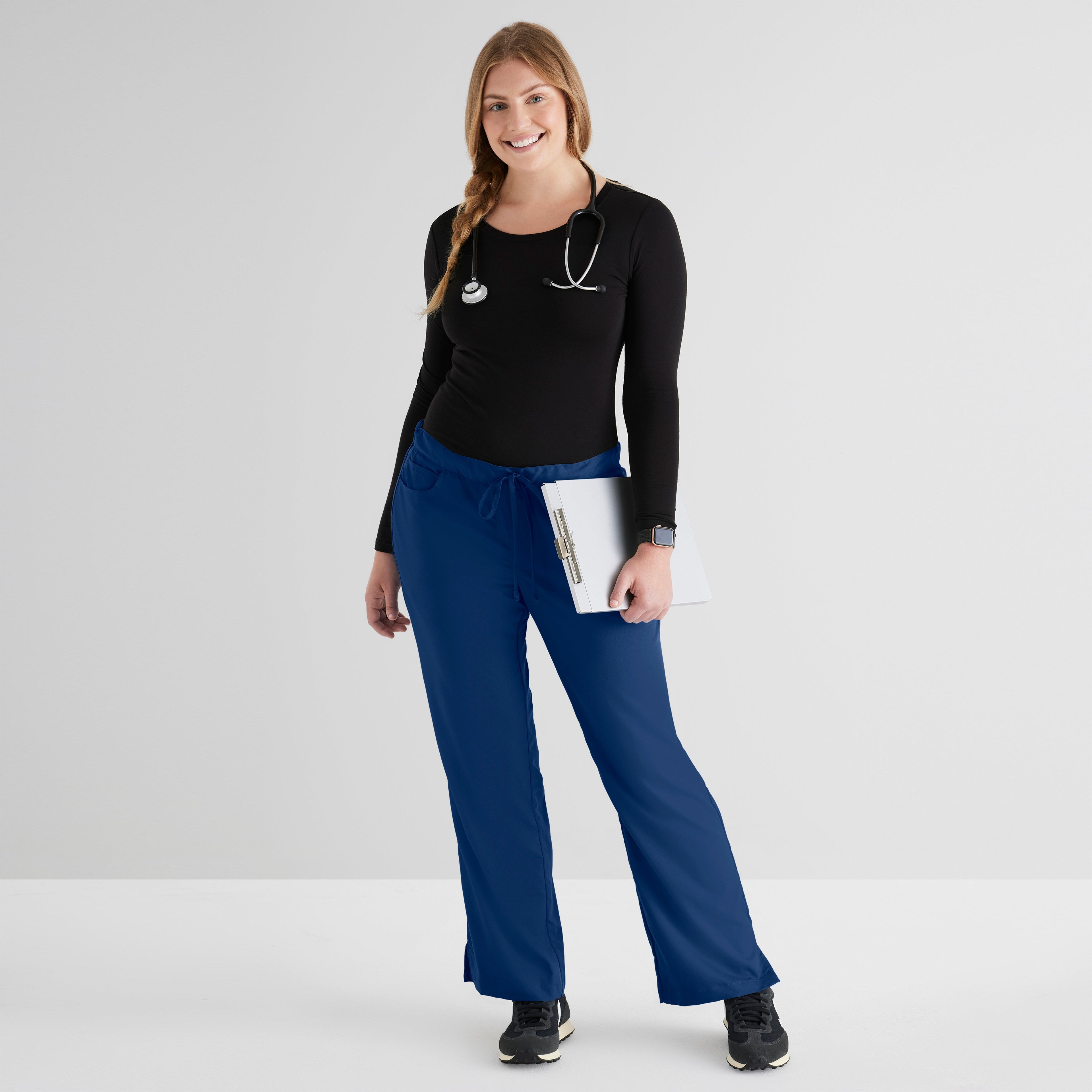Grey's Anatomy Indigo Classic Riley Pant — 5 Pocket Scrub Pants. Flare leg. Mid rise. Drawcord waist with elastic back. 