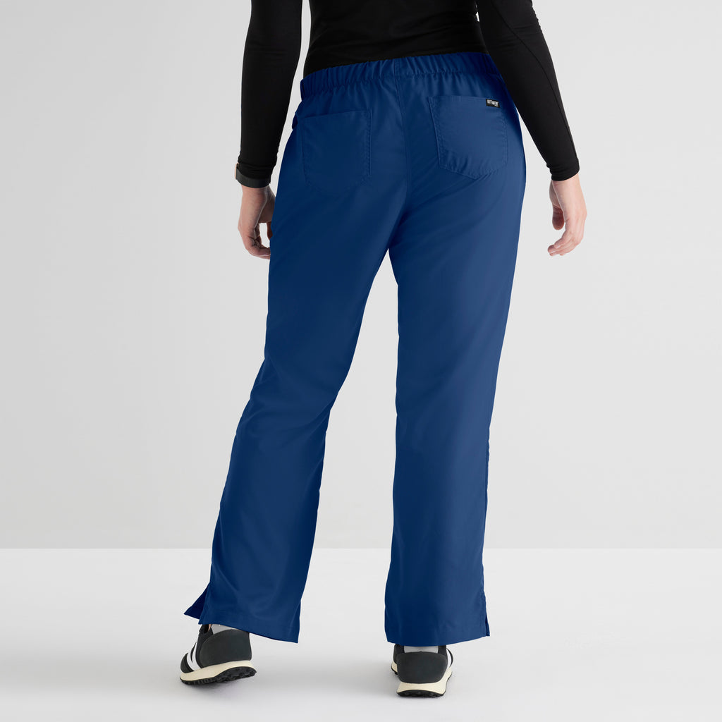 Grey's Anatomy Indigo Classic Riley Pant — 5 Pocket Scrub Pants. Flare leg. Mid rise. Drawcord waist with elastic back. 