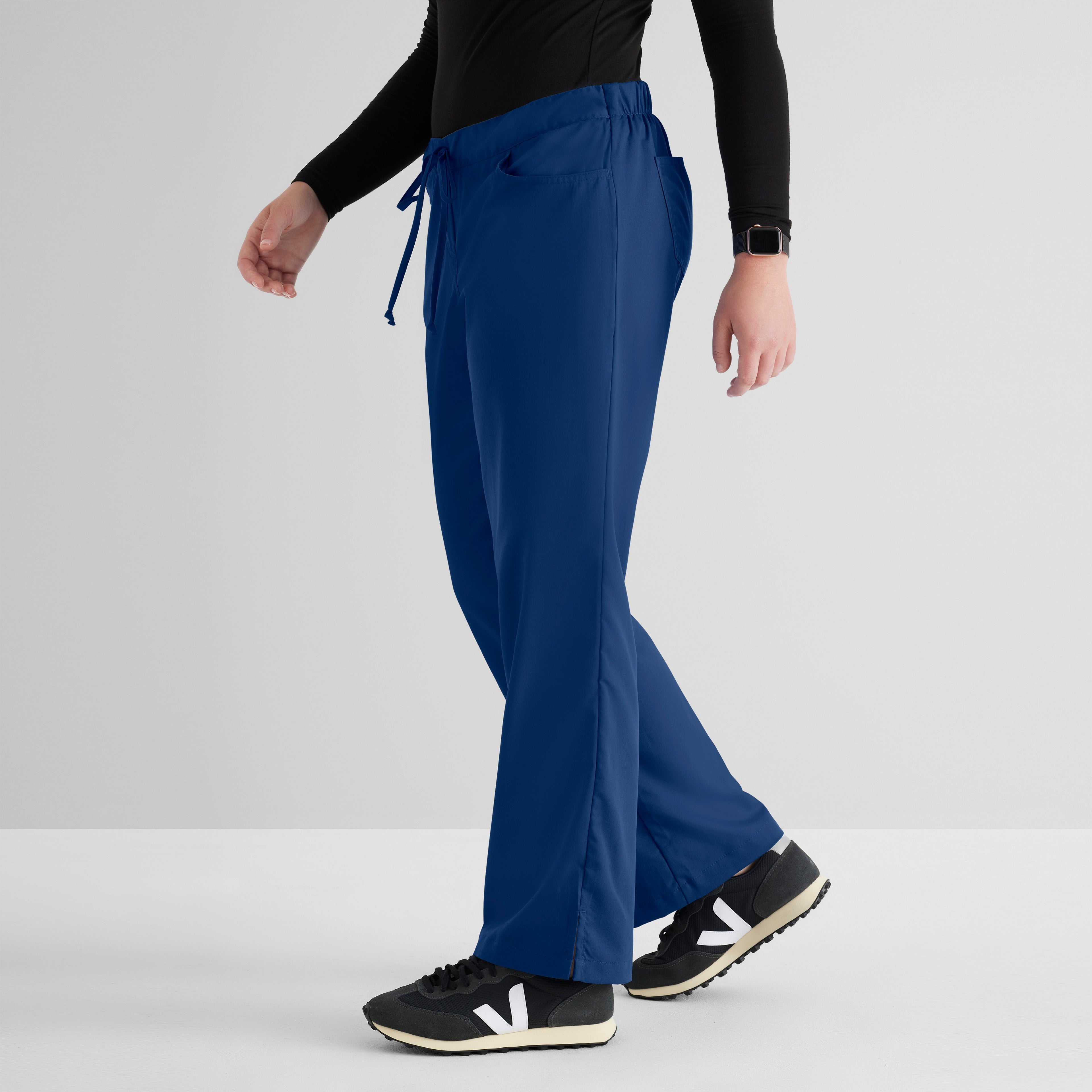 Grey's Anatomy Indigo Classic Riley Pant — 5 Pocket Scrub Pants. Flare leg. Mid rise. Drawcord waist with elastic back. 