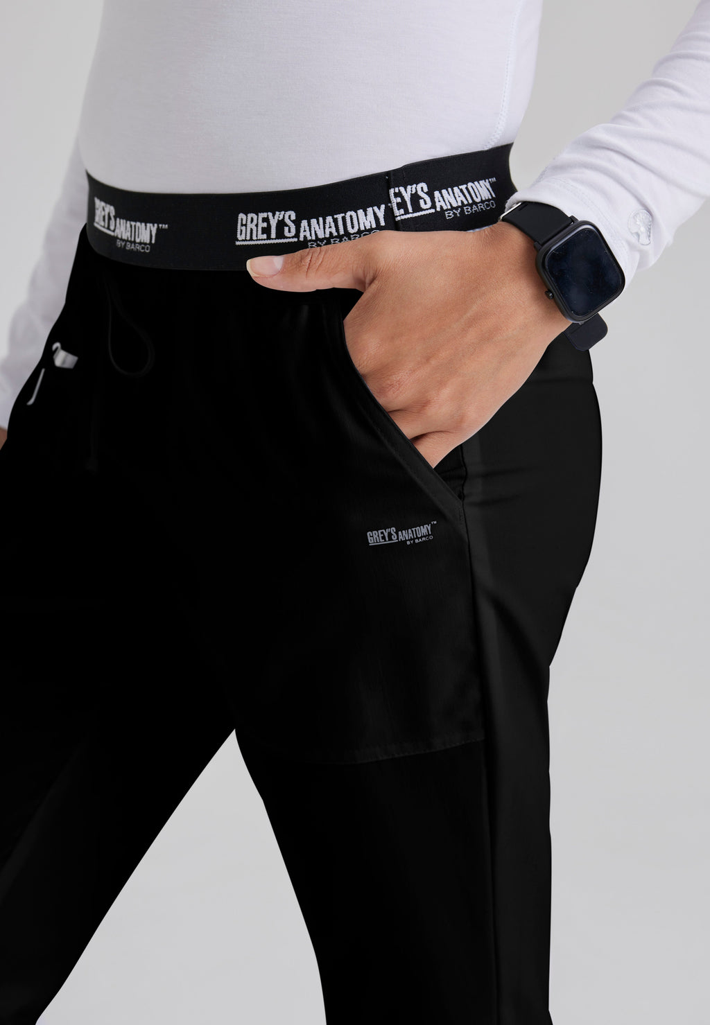 Detail Shot of the Aubrey 3-Pocket Low-Rise Flared Leg Scrub Pant in Black from Grey's Anatomy™ by Barco Classic