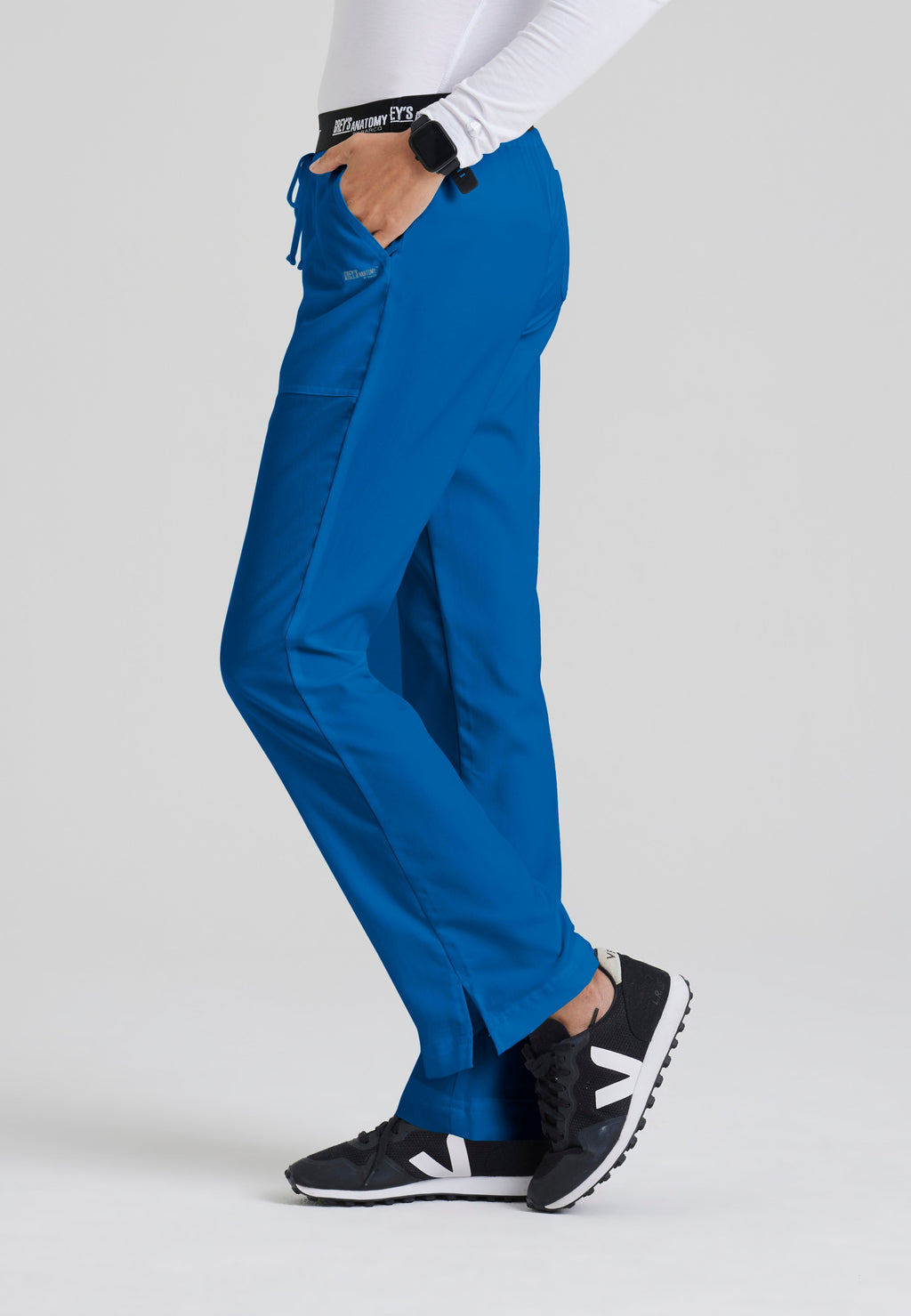 Side View of the Aubrey 3-Pocket Low-Rise Flared Leg Scrub Pant in New Royal from Grey's Anatomy™ by Barco Classic