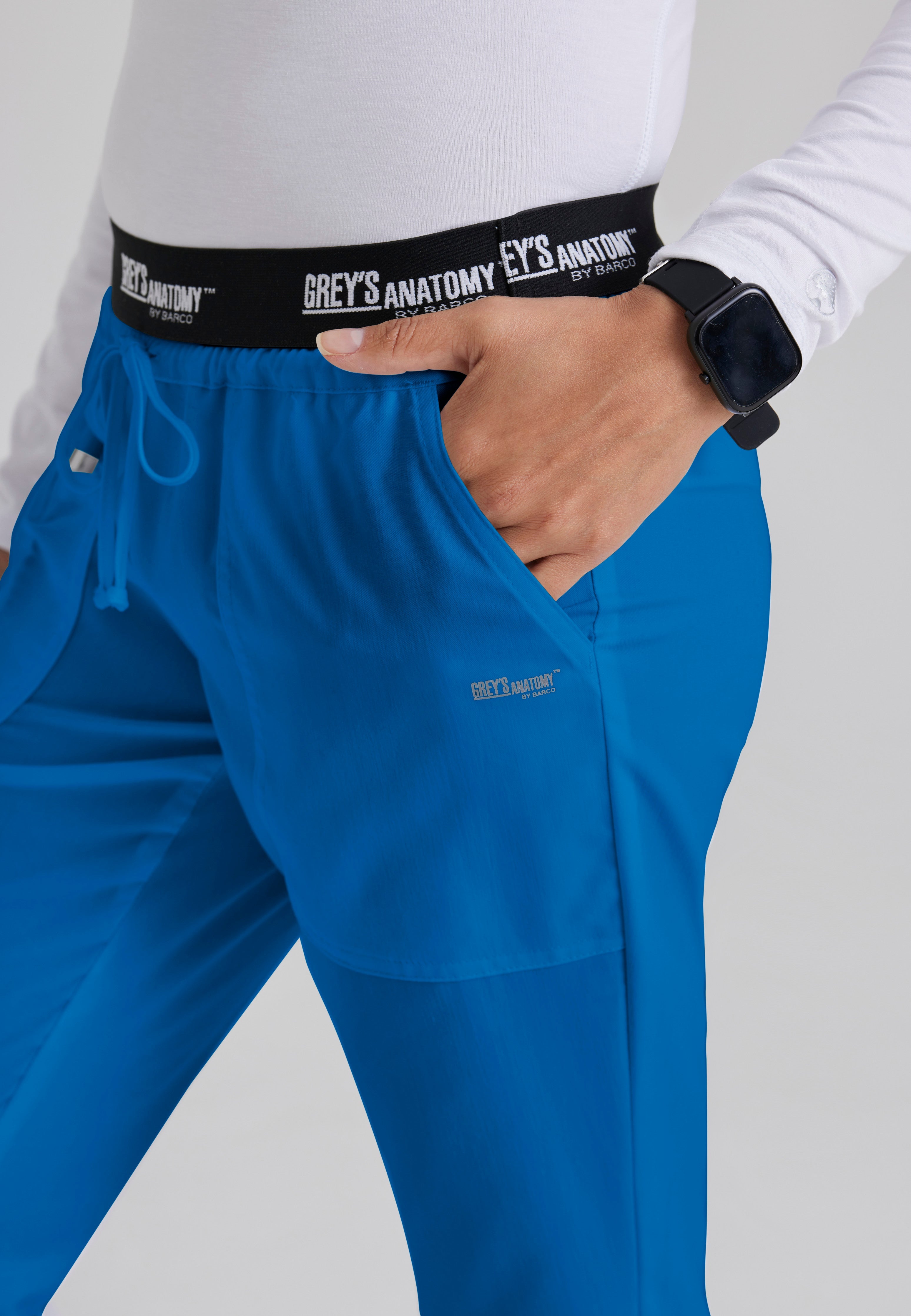 Detail Shot of the Aubrey 3-Pocket Low-Rise Flared Leg Scrub Pant in New Royal from Grey's Anatomy™ by Barco Classic