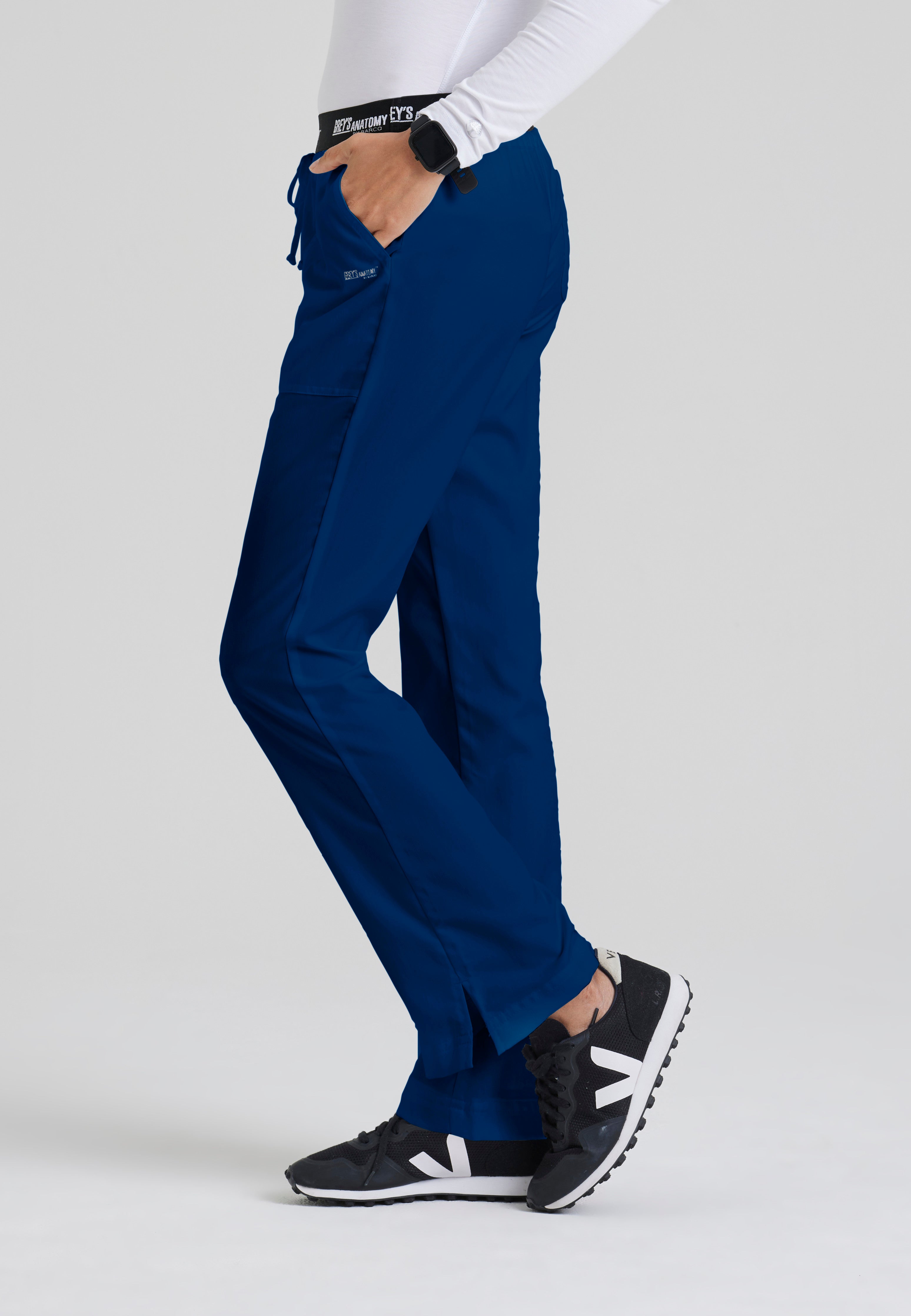 Side View of the Aubrey 3-Pocket Low-Rise Flared Leg Scrub Pant in Indigo from Grey's Anatomy™ by Barco Classic