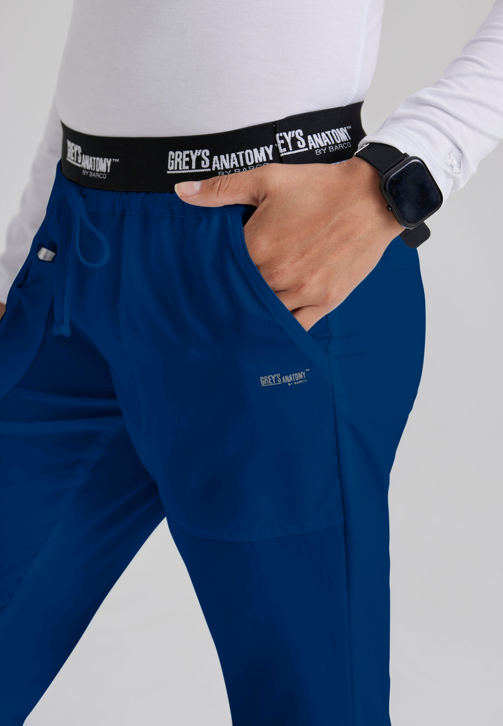 Detail Shot of the Aubrey 3-Pocket Low-Rise Flared Leg Scrub Pant in Indigo from Grey's Anatomy™ by Barco Classic