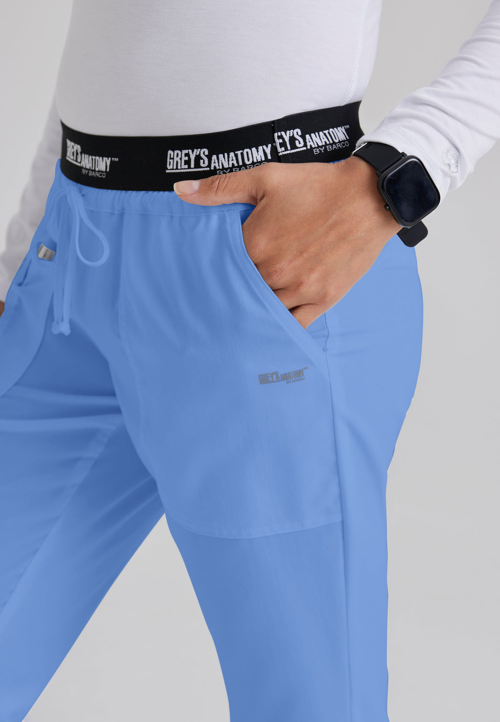 Detail Shot of the Aubrey 3-Pocket Low-Rise Flared Leg Scrub Pant in Ciel Blue from Grey's Anatomy™ by Barco Classic