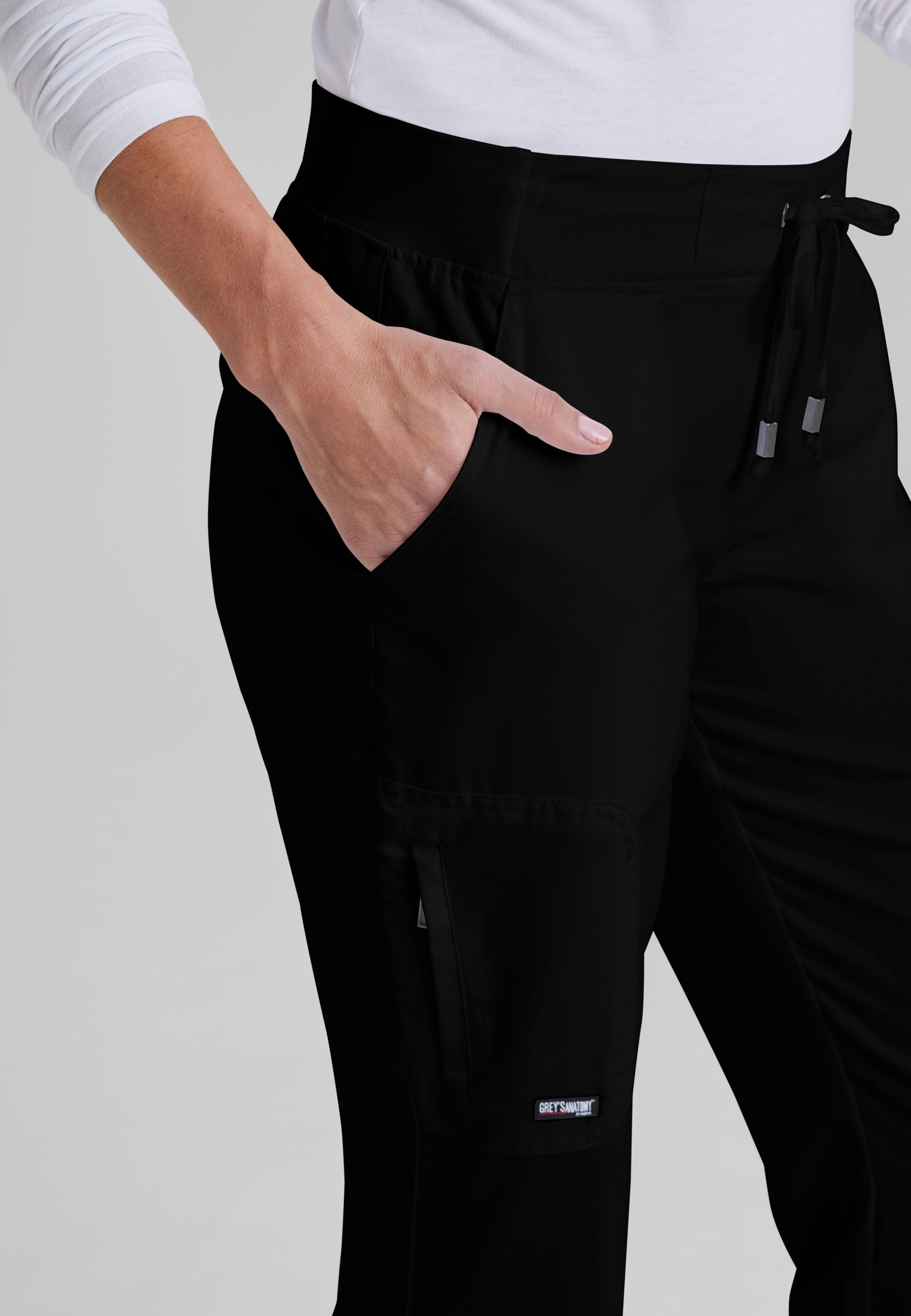 Detail Shot of the Mia 6-Pocket Mid-Rise Straight Leg Scrub Pant in Black from Grey's Anatomy™ by Barco Classic
