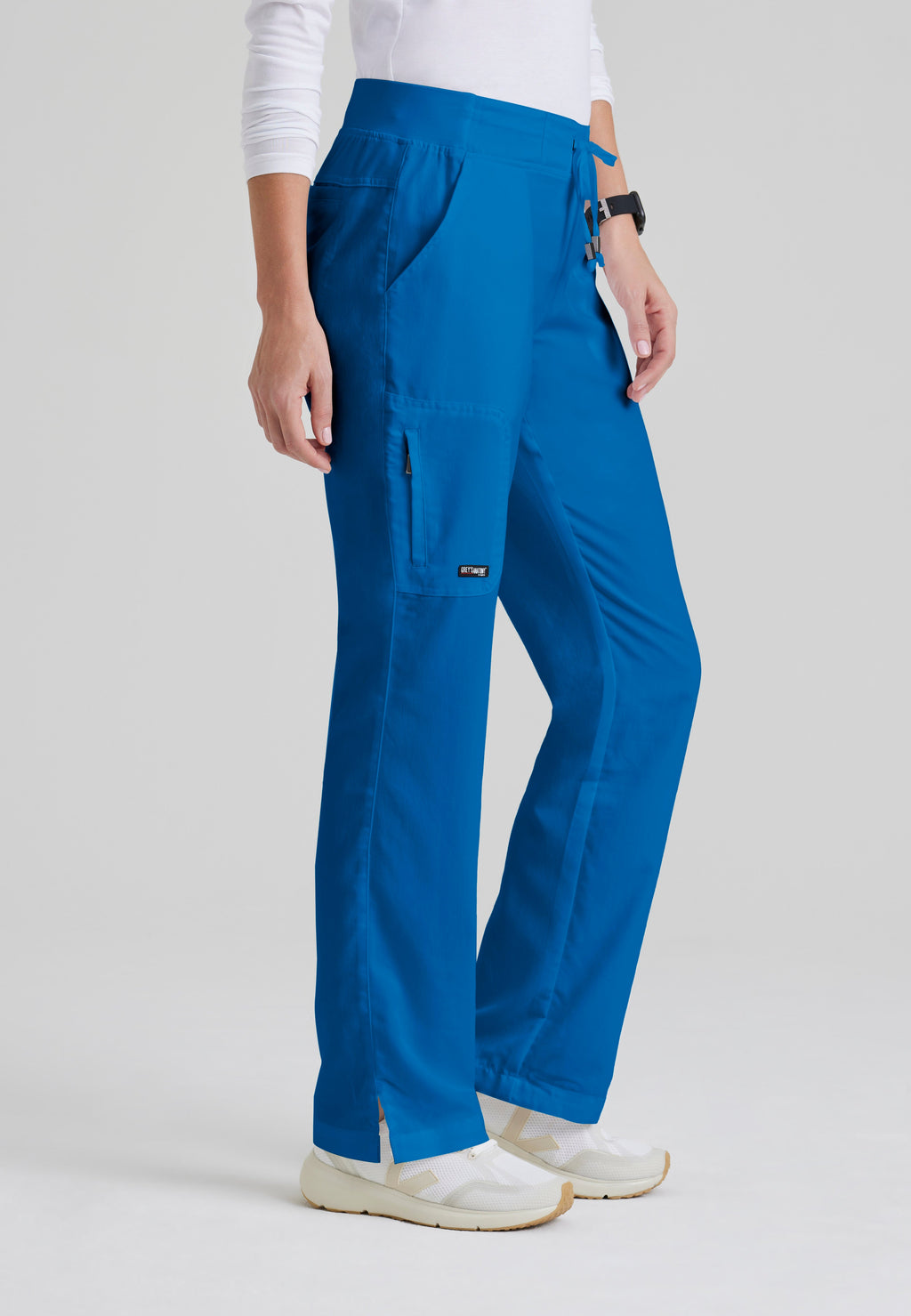 Side View of the Mia 6-Pocket Mid-Rise Straight Leg Scrub Pant in New Royal from Grey's Anatomy™ by Barco Classic