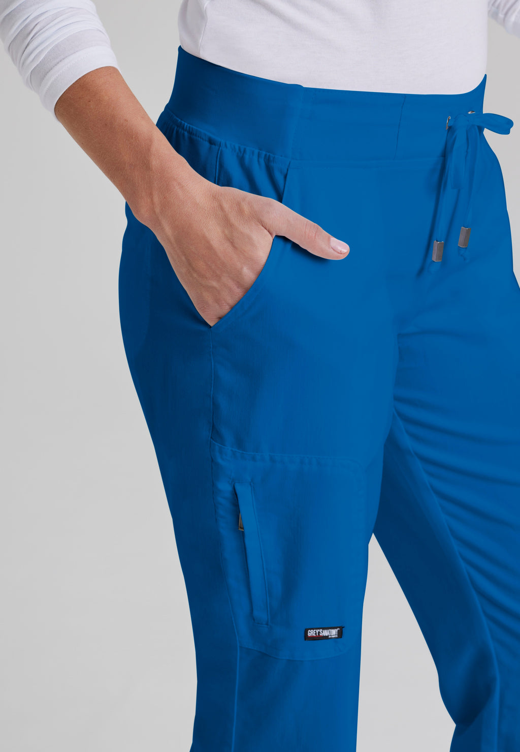 Detail Shot of the Mia 6-Pocket Mid-Rise Straight Leg Scrub Pant in New Royal from Grey's Anatomy™ by Barco Classic