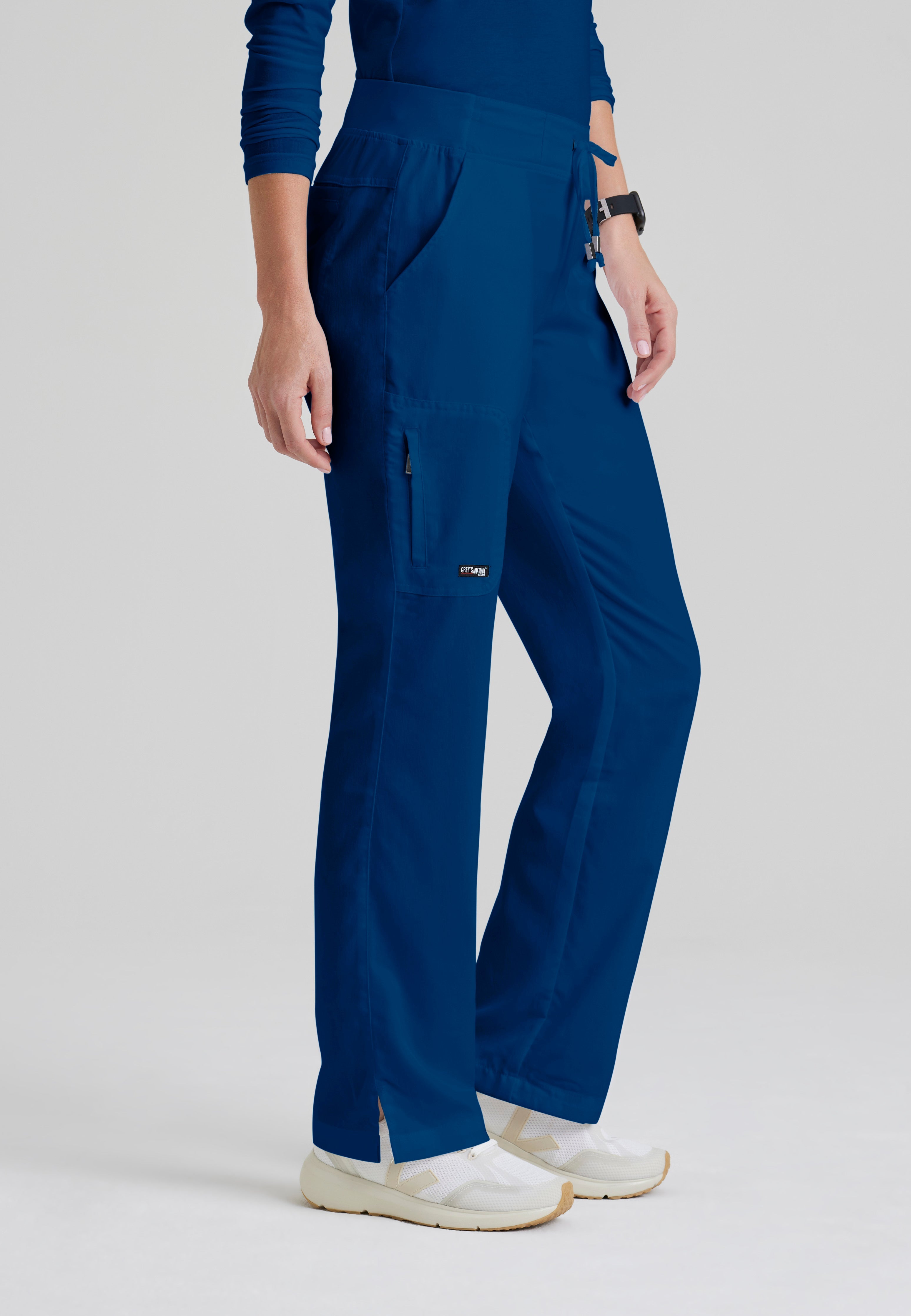 Side View of the Mia 6-Pocket Mid-Rise Straight Leg Scrub Pant in Indigo from Grey's Anatomy™ by Barco Classic