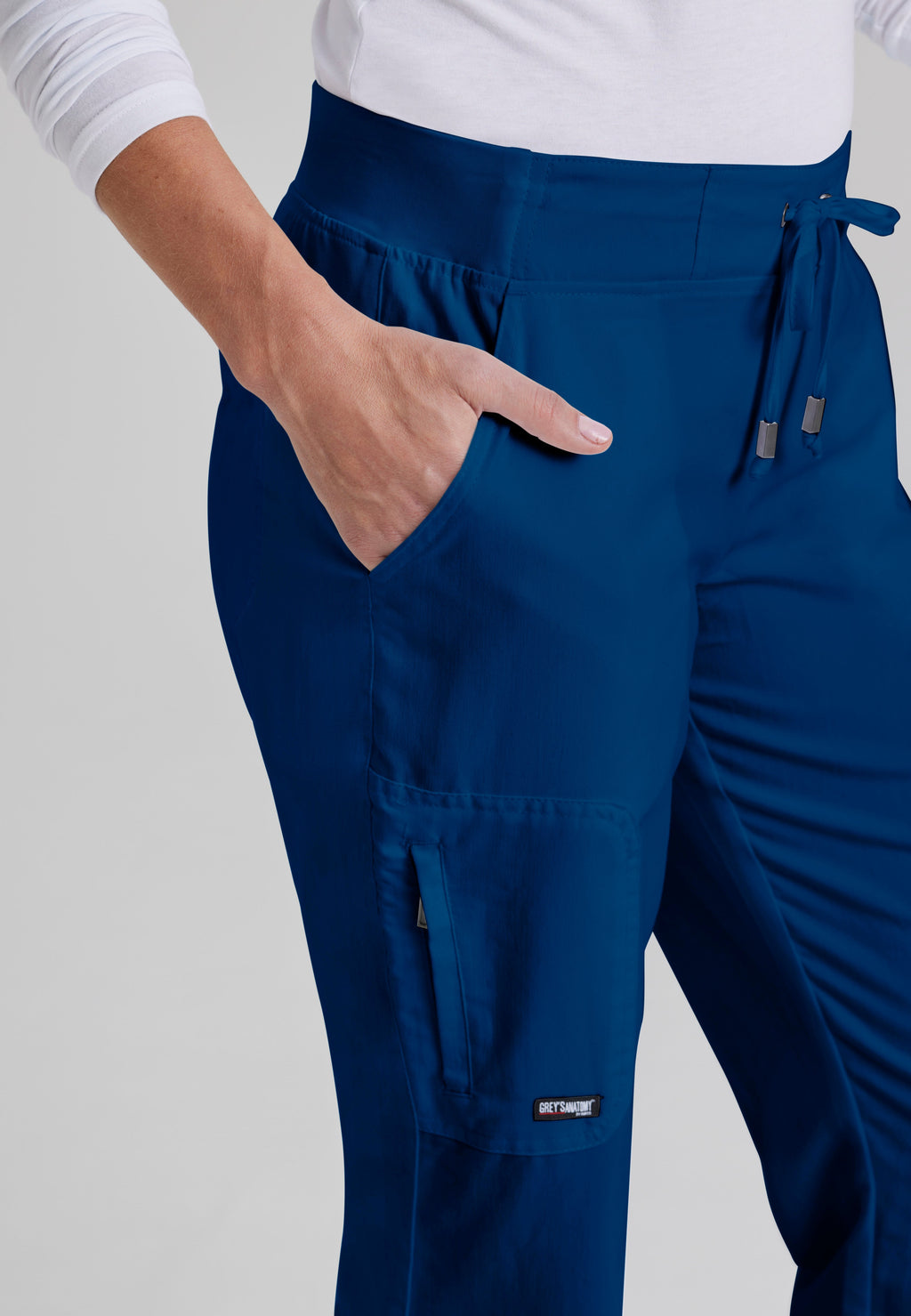 Detail Shot of the Mia 6-Pocket Mid-Rise Straight Leg Scrub Pant in Indigo from Grey's Anatomy™ by Barco Classic