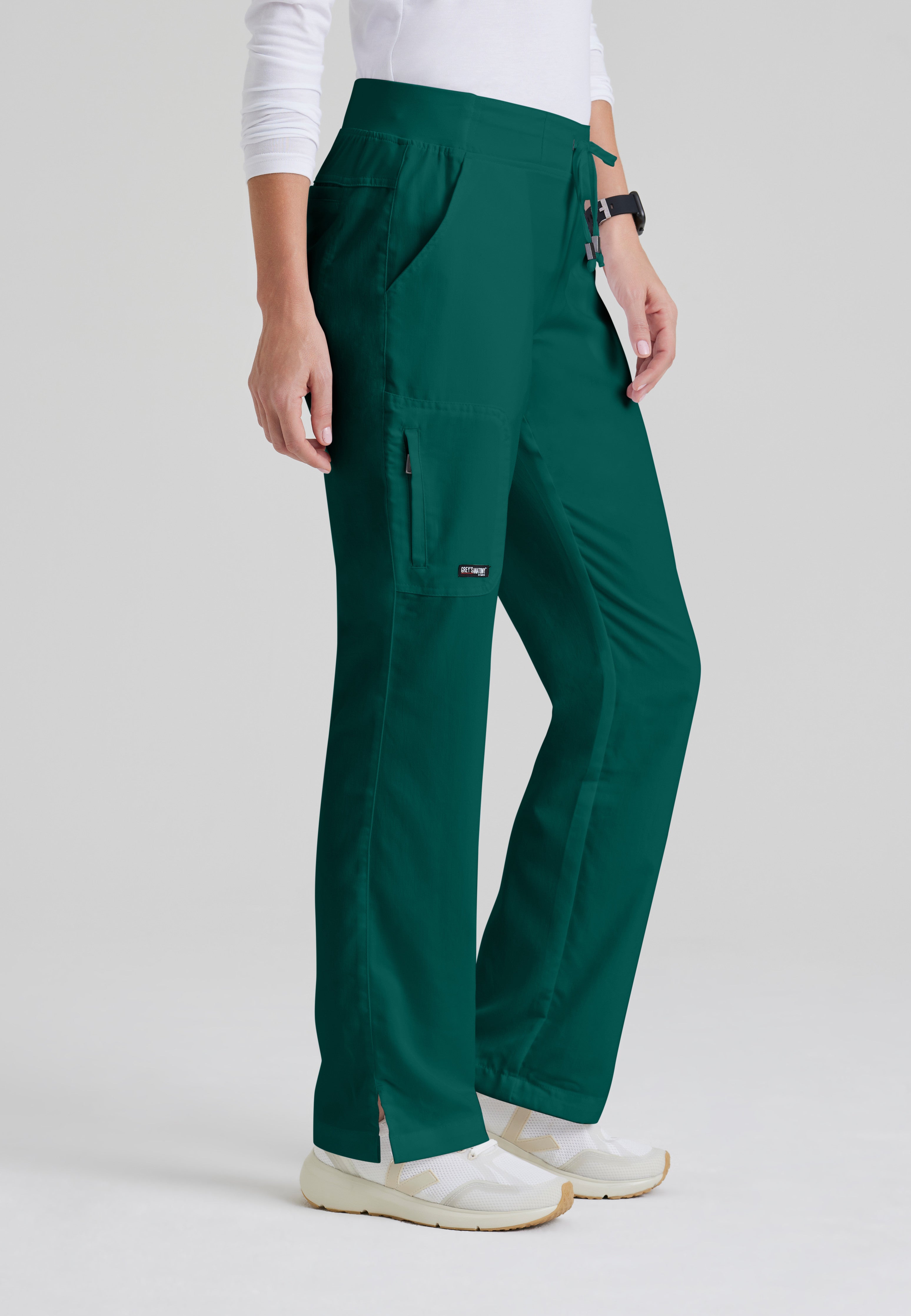 Side View of the Mia 6-Pocket Mid-Rise Straight Leg Scrub Pant in Hunter Green from Grey's Anatomy™ by Barco Classic