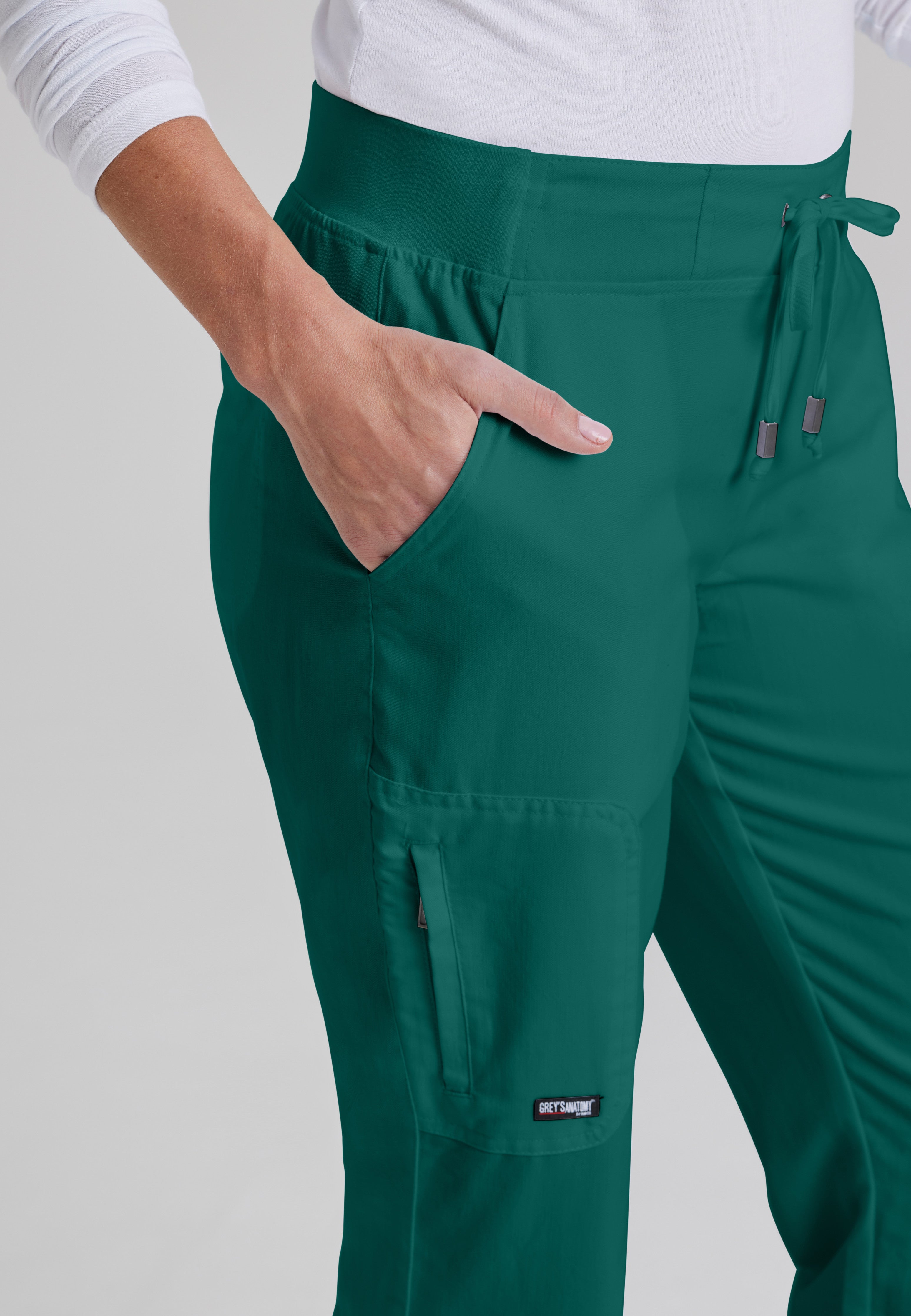 Detail Shot of the Mia 6-Pocket Mid-Rise Straight Leg Scrub Pant in Hunter Green from Grey's Anatomy™ by Barco Classic