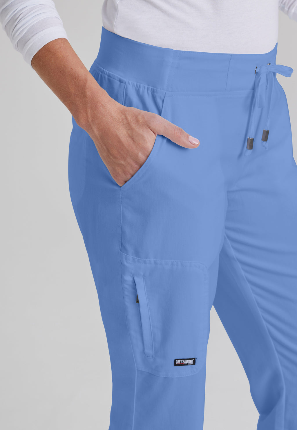Detail Shot of the Mia 6-Pocket Mid-Rise Straight Leg Scrub Pant in Ciel Blue from Grey's Anatomy™ by Barco Classic