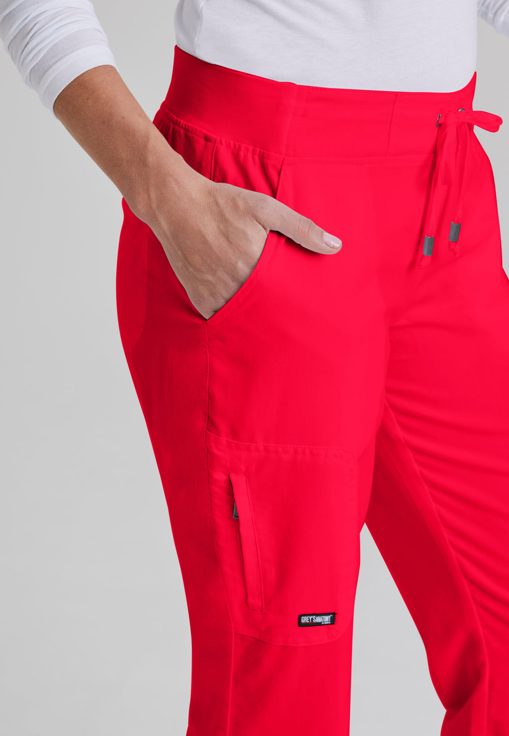 Detail Shot of the Mia 6-Pocket Mid-Rise Straight Leg Scrub Pant in Scarlet Red from Grey's Anatomy™ by Barco Classic