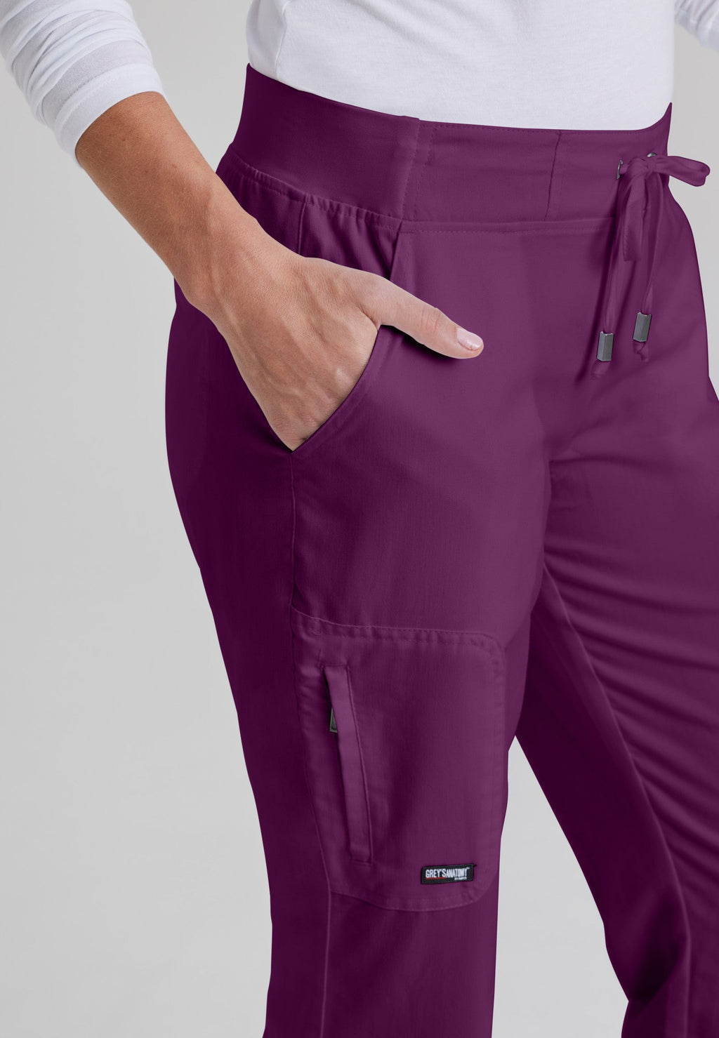 Detail Shot of the Mia 6-Pocket Mid-Rise Straight Leg Scrub Pant in Wine from Grey's Anatomy™ by Barco Classic