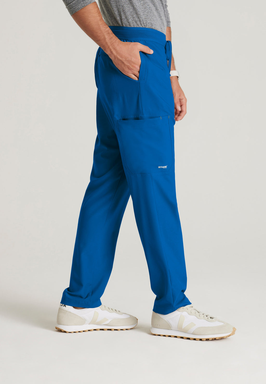 Side View of the Highland 5-Pocket Slim Straight Leg Ciclo® Scrub Pant in New Royal from Grey's Anatomy™ by Barco Evolve
