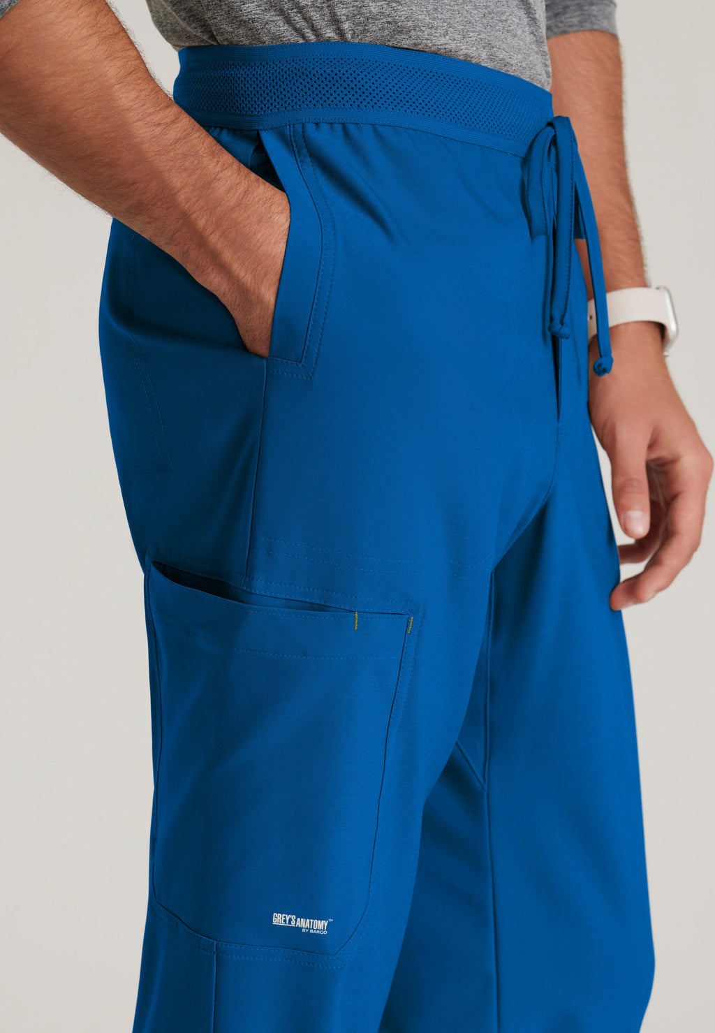 Detail Shot of the Highland 5-Pocket Slim Straight Leg Ciclo® Scrub Pant in New Royal from Grey's Anatomy™ by Barco Evolve