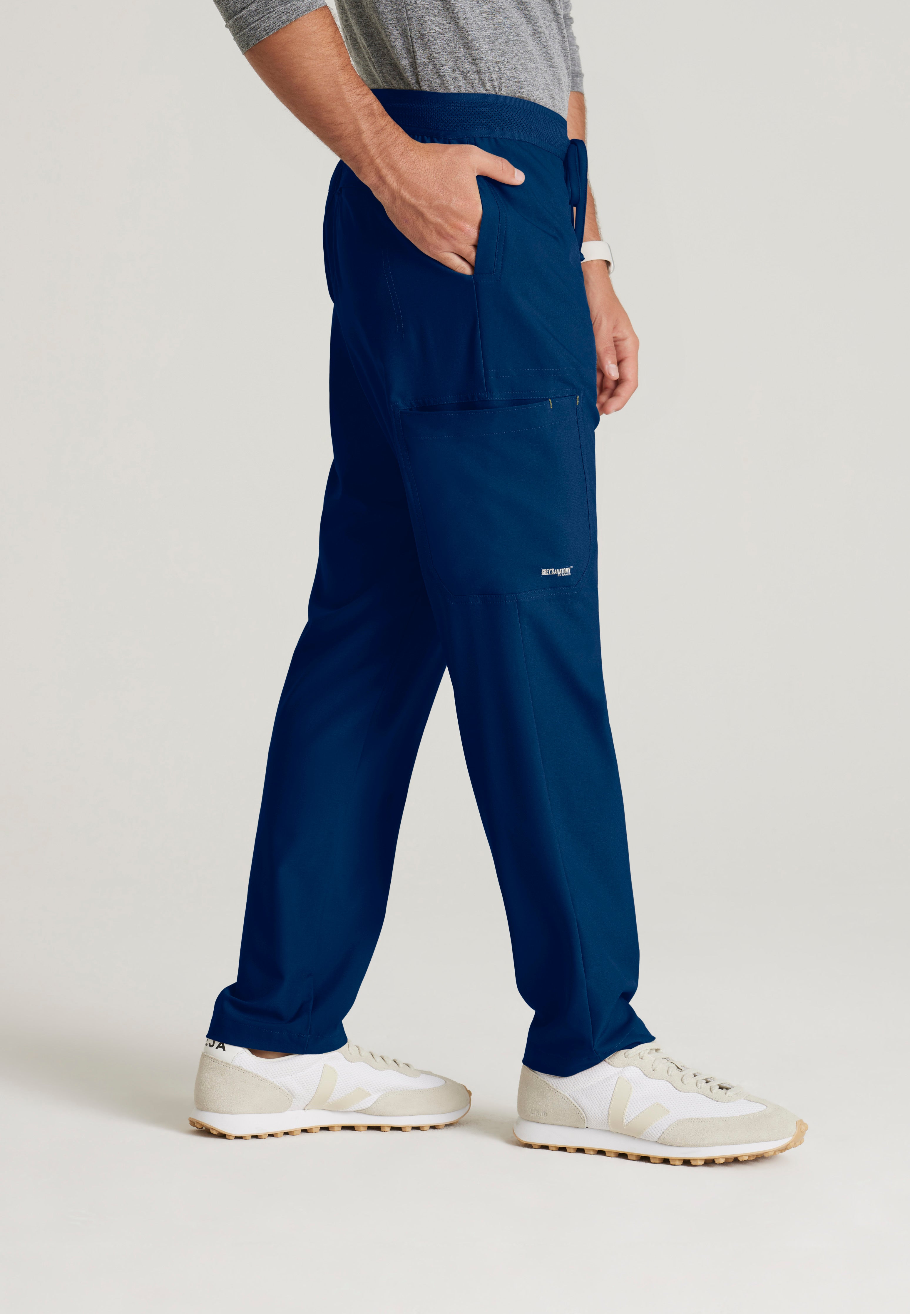Side View of the Highland 5-Pocket Slim Straight Leg Ciclo® Scrub Pant in Indigo from Grey's Anatomy™ by Barco Evolve