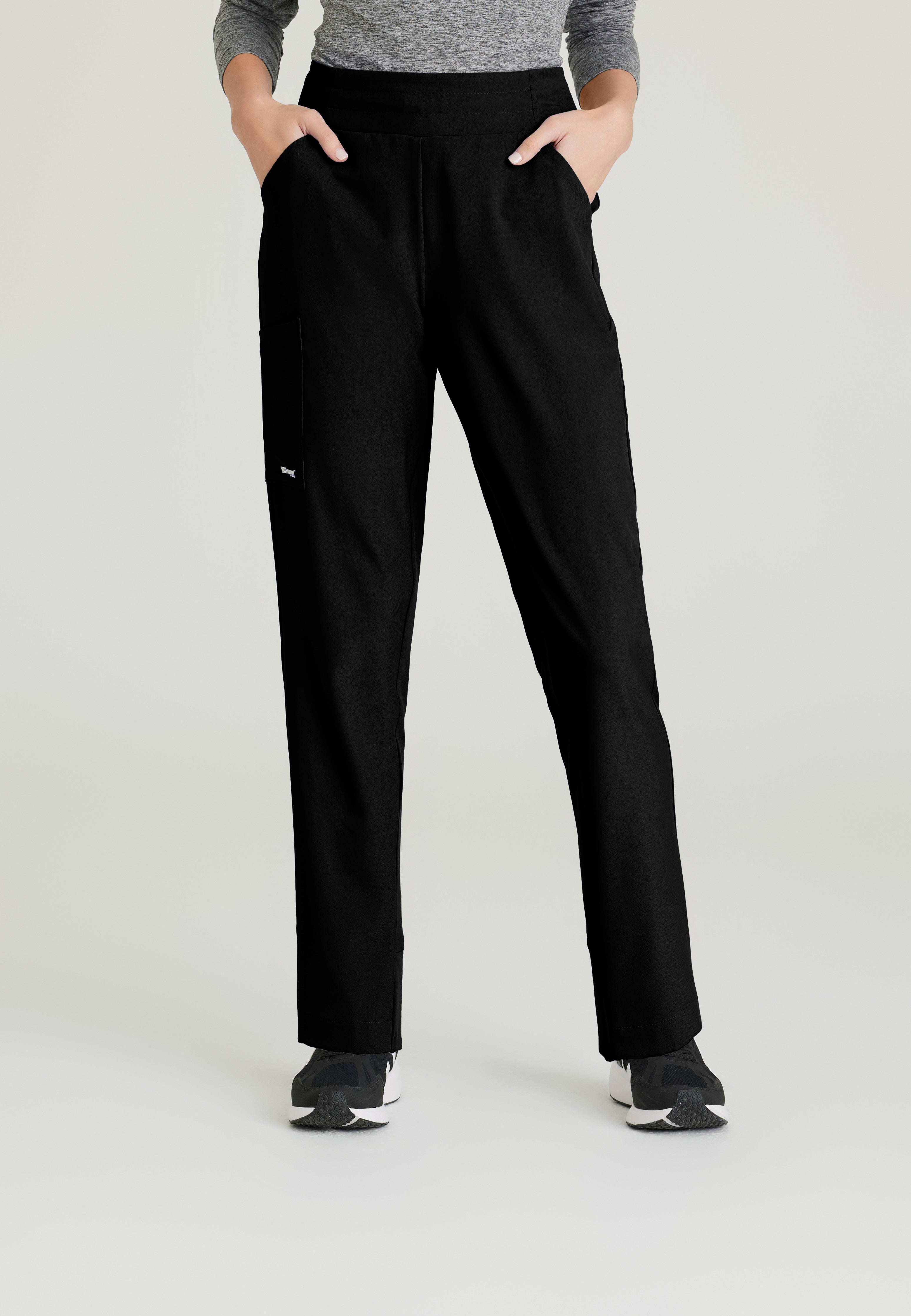 Front View of the Flight 5-Pocket High Rise Tapered Leg Pant in Black from Grey's Anatomy™ by Barco Evolve