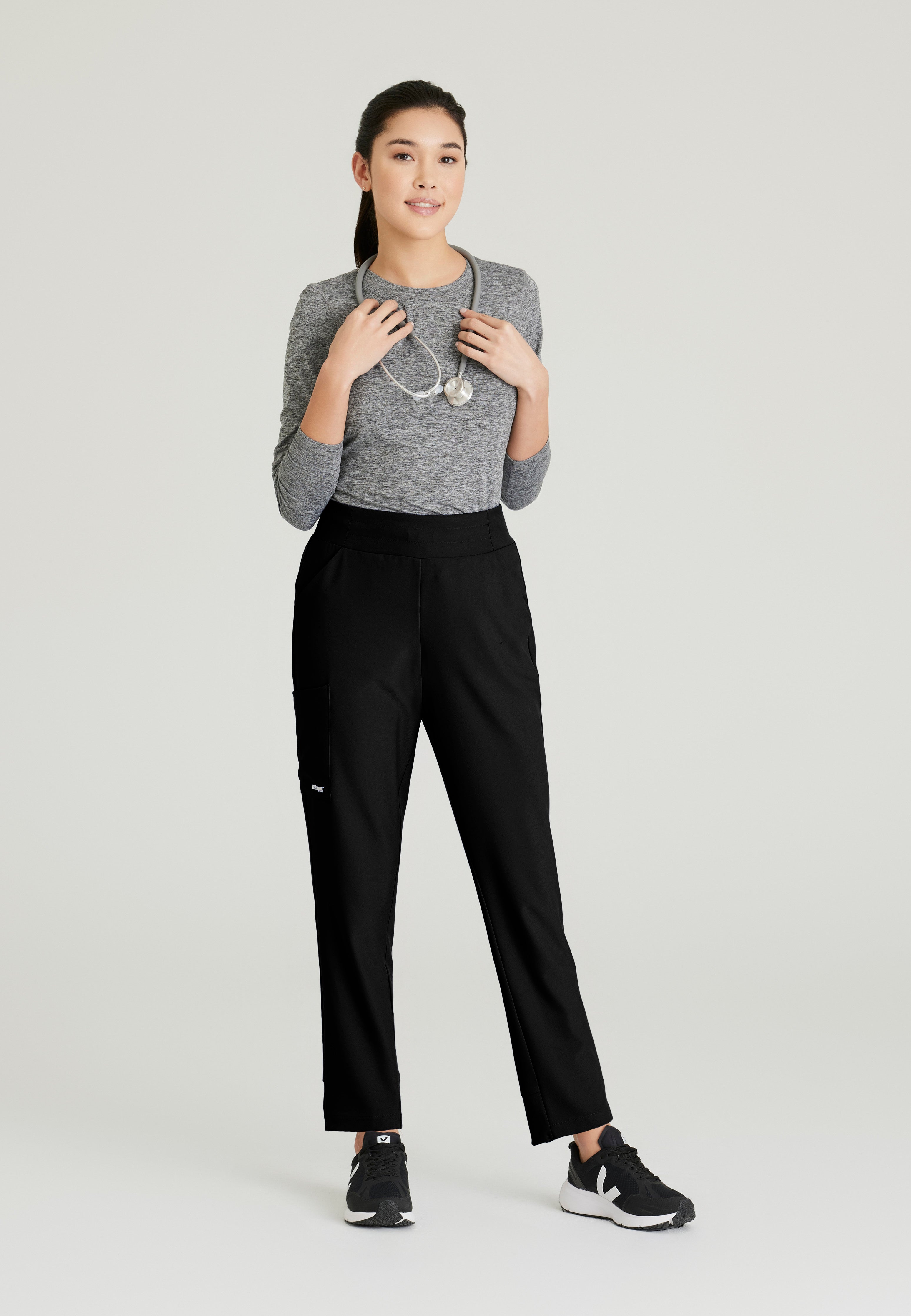 Full Body View of the Flight 5-Pocket High Rise Tapered Leg Pant in Black from Grey's Anatomy™ by Barco Evolve