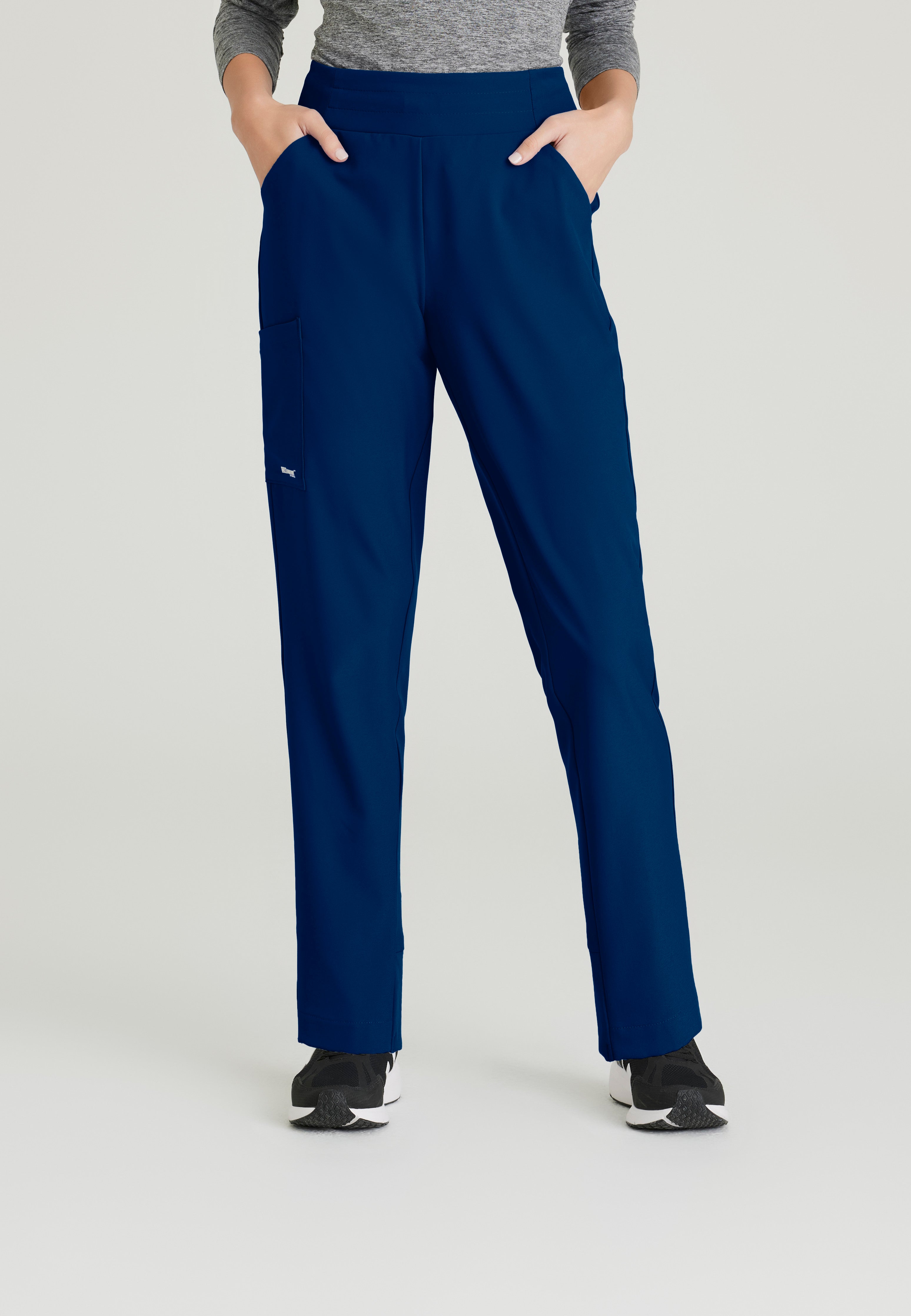 Front View of the Flight 5-Pocket High Rise Tapered Leg Pant in Indigo from Grey's Anatomy™ by Barco Evolve