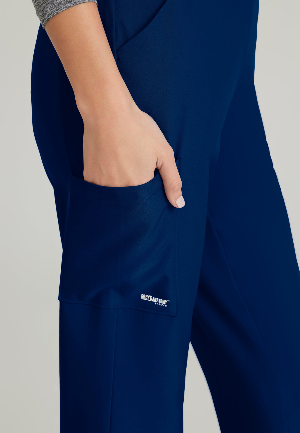 Detail Shot of the Flight 5-Pocket High Rise Tapered Leg Pant in Indigo from Grey's Anatomy™ by Barco Evolve