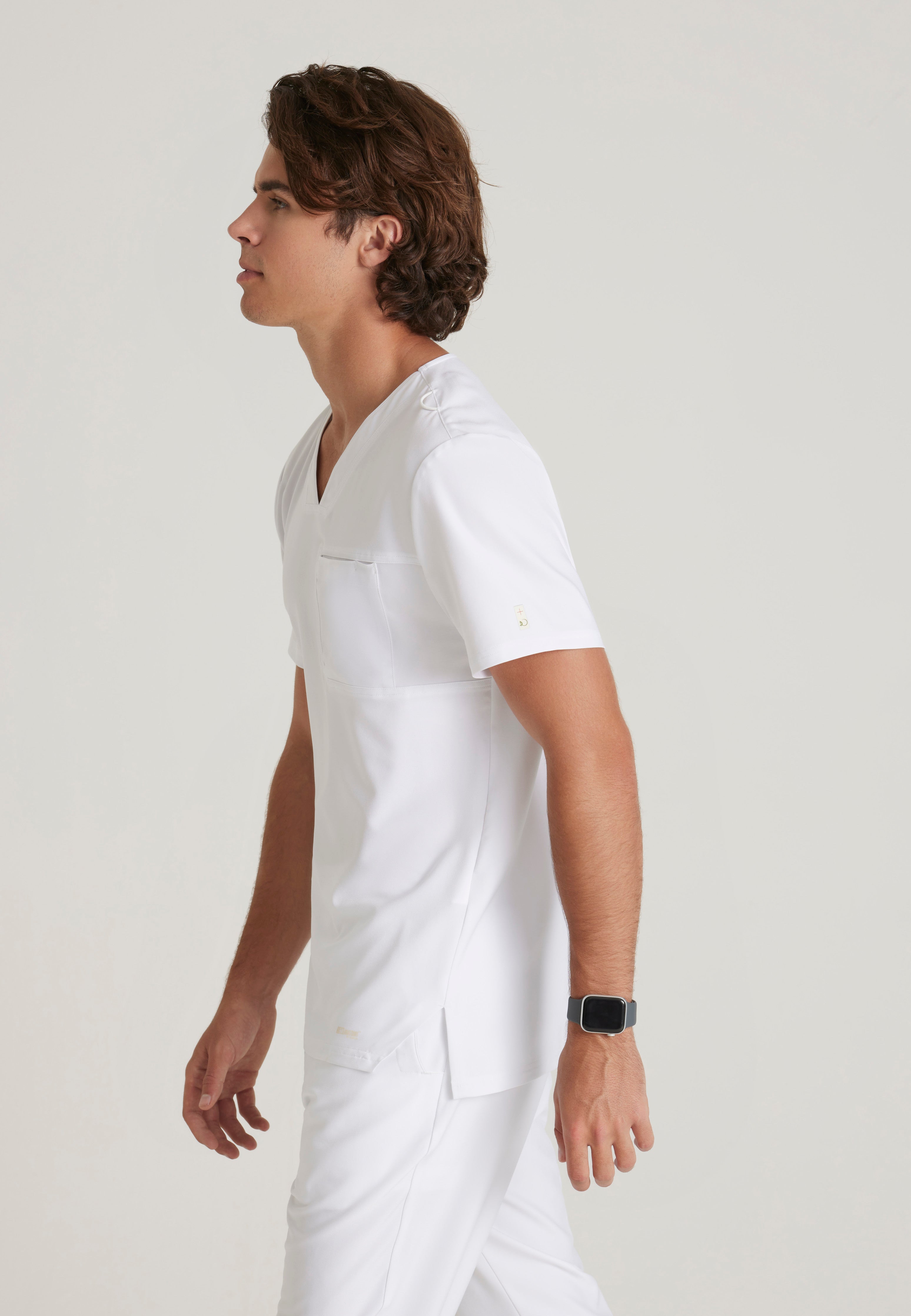 Side View of the Journey 1-Pocket Ciclo® Scrub Top in White from Grey's Anatomy™ by Barco Evolve
