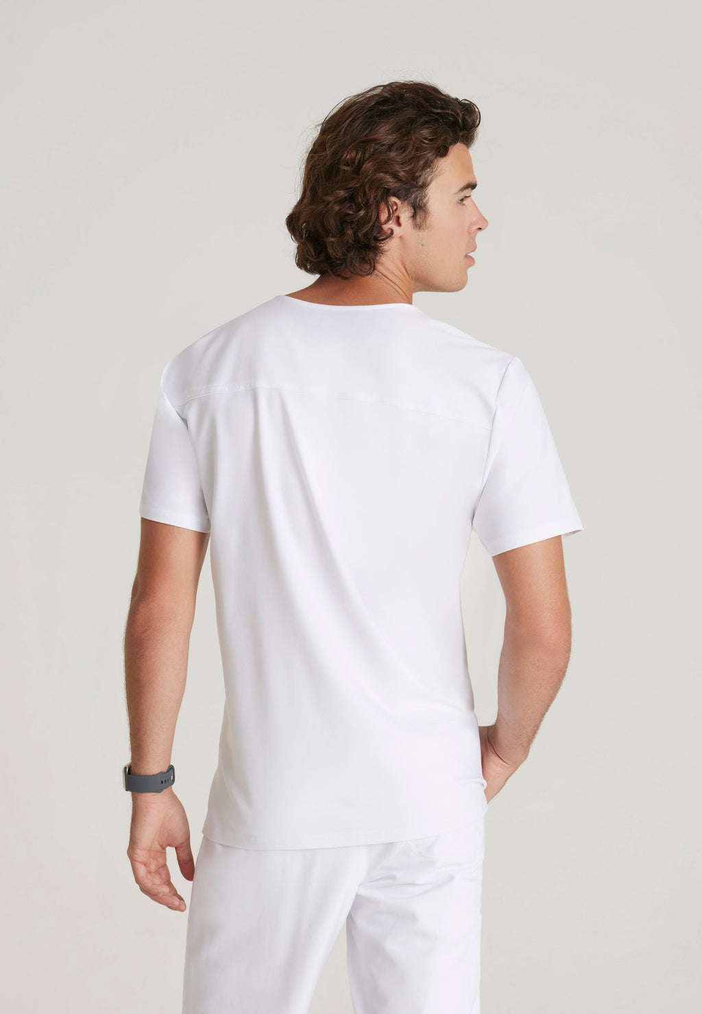 Back View of the Journey 1-Pocket Ciclo® Scrub Top in White from Grey's Anatomy™ by Barco Evolve