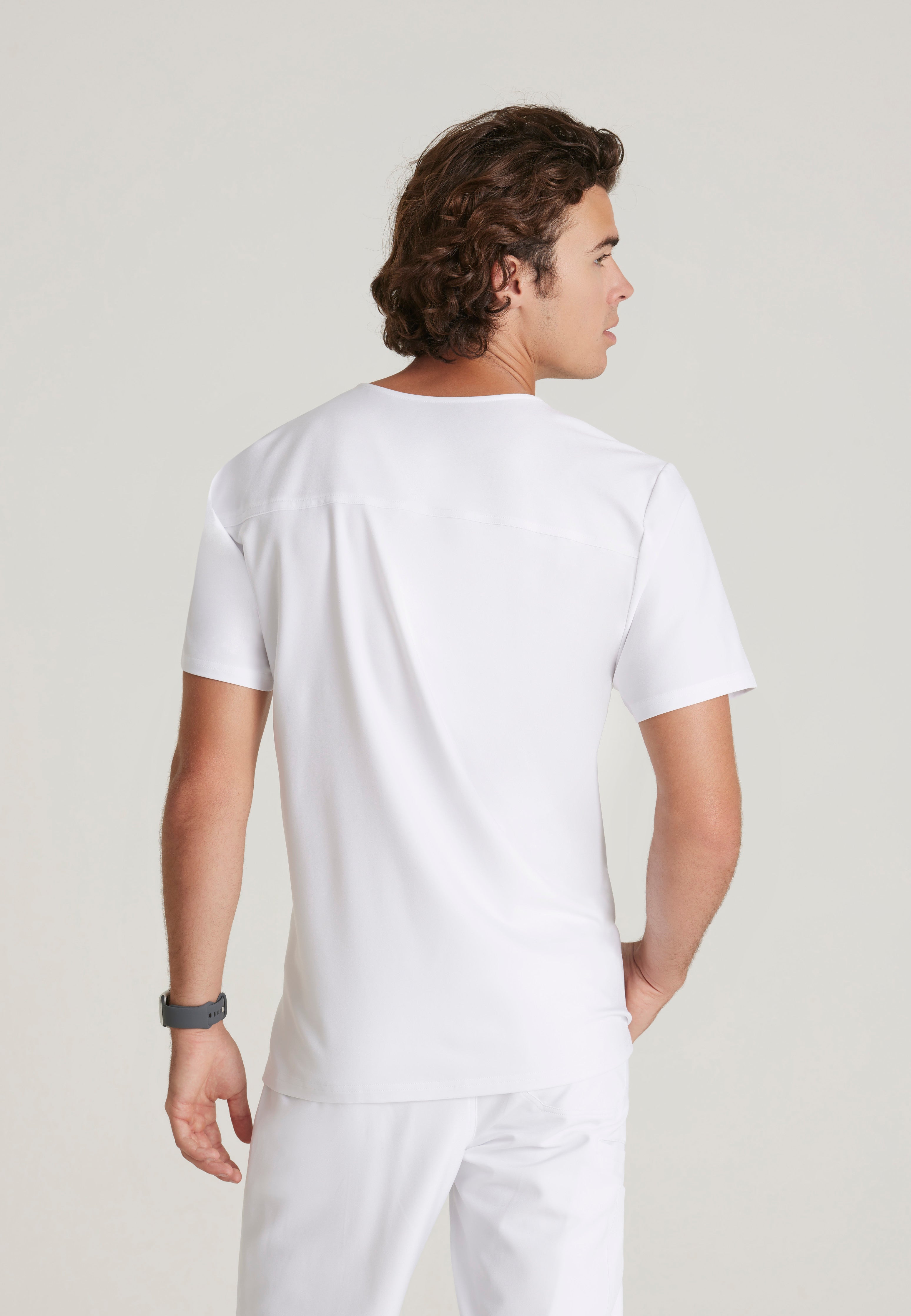 Back View of the Journey 1-Pocket Ciclo® Scrub Top in White from Grey's Anatomy™ by Barco Evolve