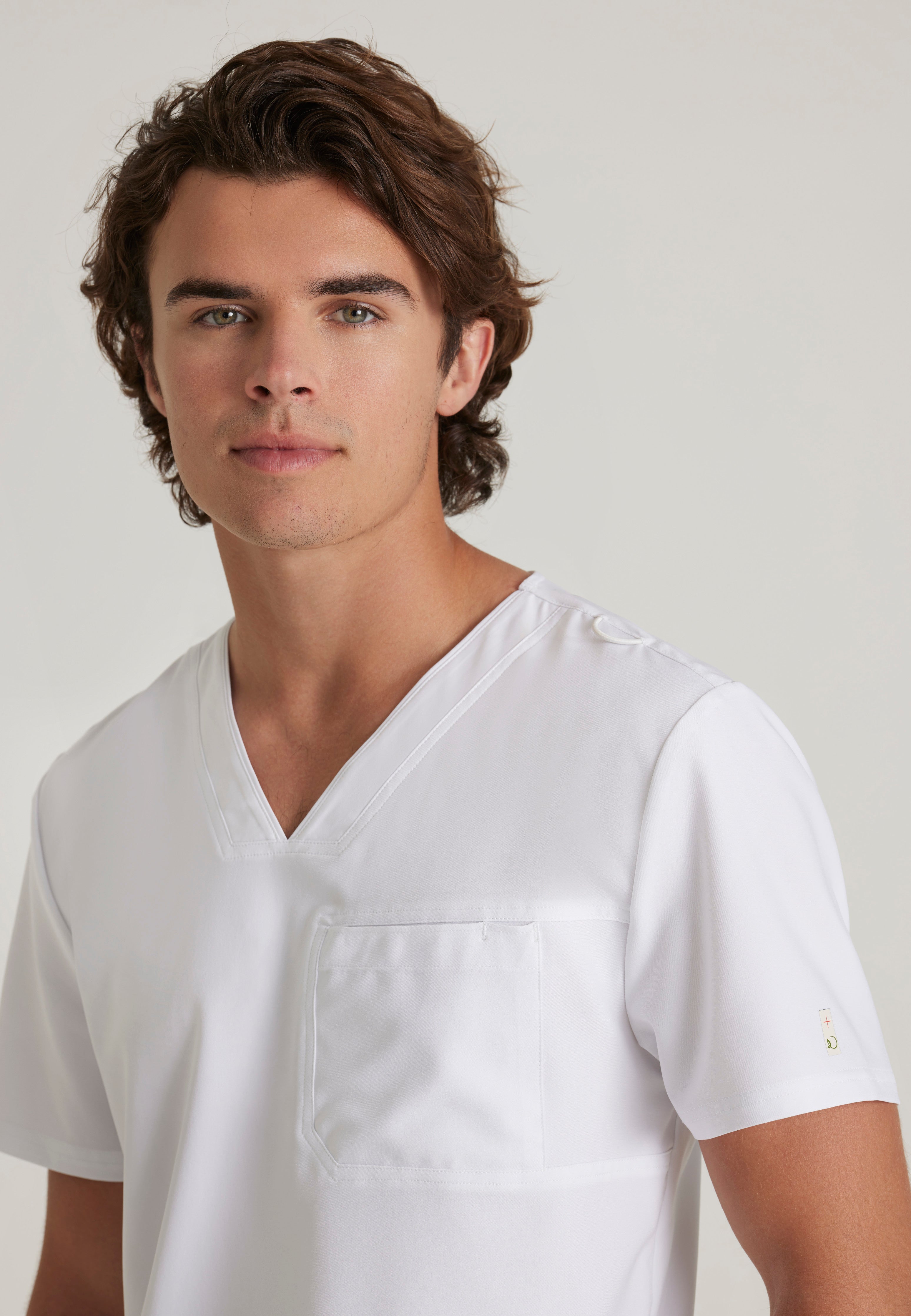 Detail Shot of the Journey 1-Pocket Ciclo® Scrub Top in White from Grey's Anatomy™ by Barco Evolve