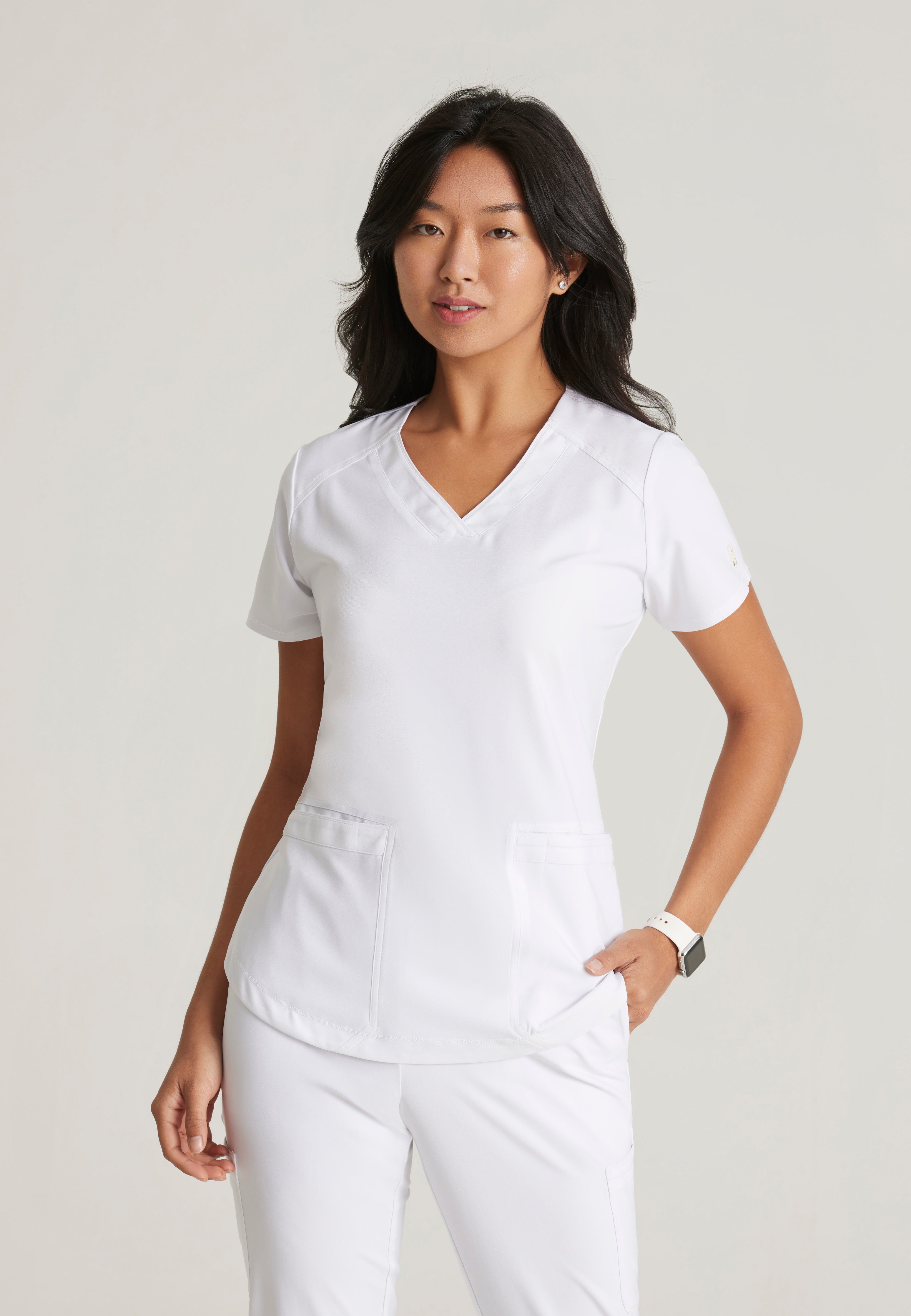 Front View of the Rhythm 2-Pocket Ciclo® Scrub Top in White from Grey's Anatomy™ by Barco Evolve