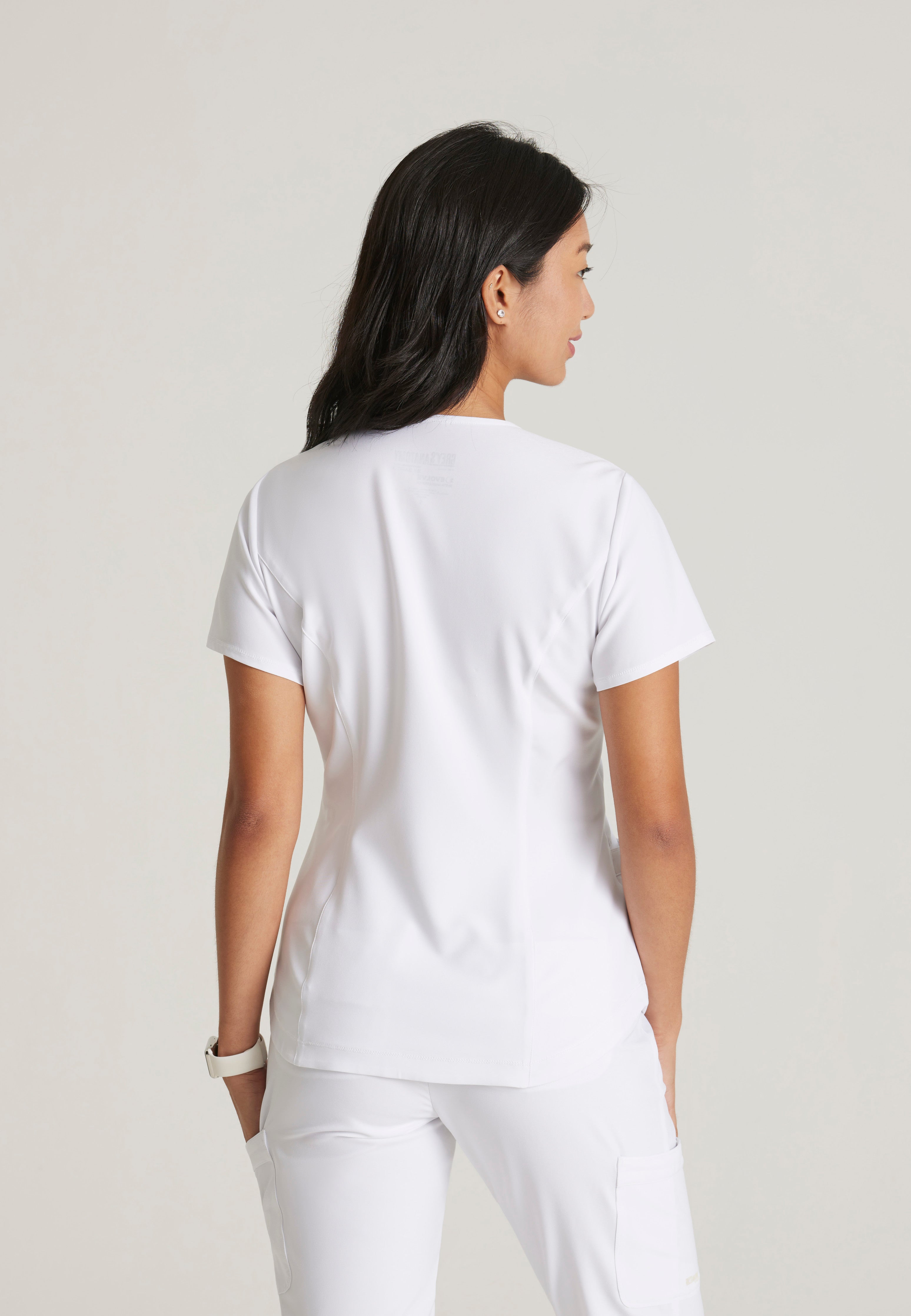 Back View of the Rhythm 2-Pocket Ciclo® Scrub Top in White from Grey's Anatomy™ by Barco Evolve