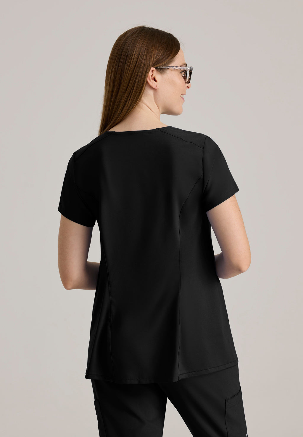 Back View of the Promise Maternity Top in Black from Grey's Anatomy™ by Barco Evolve
