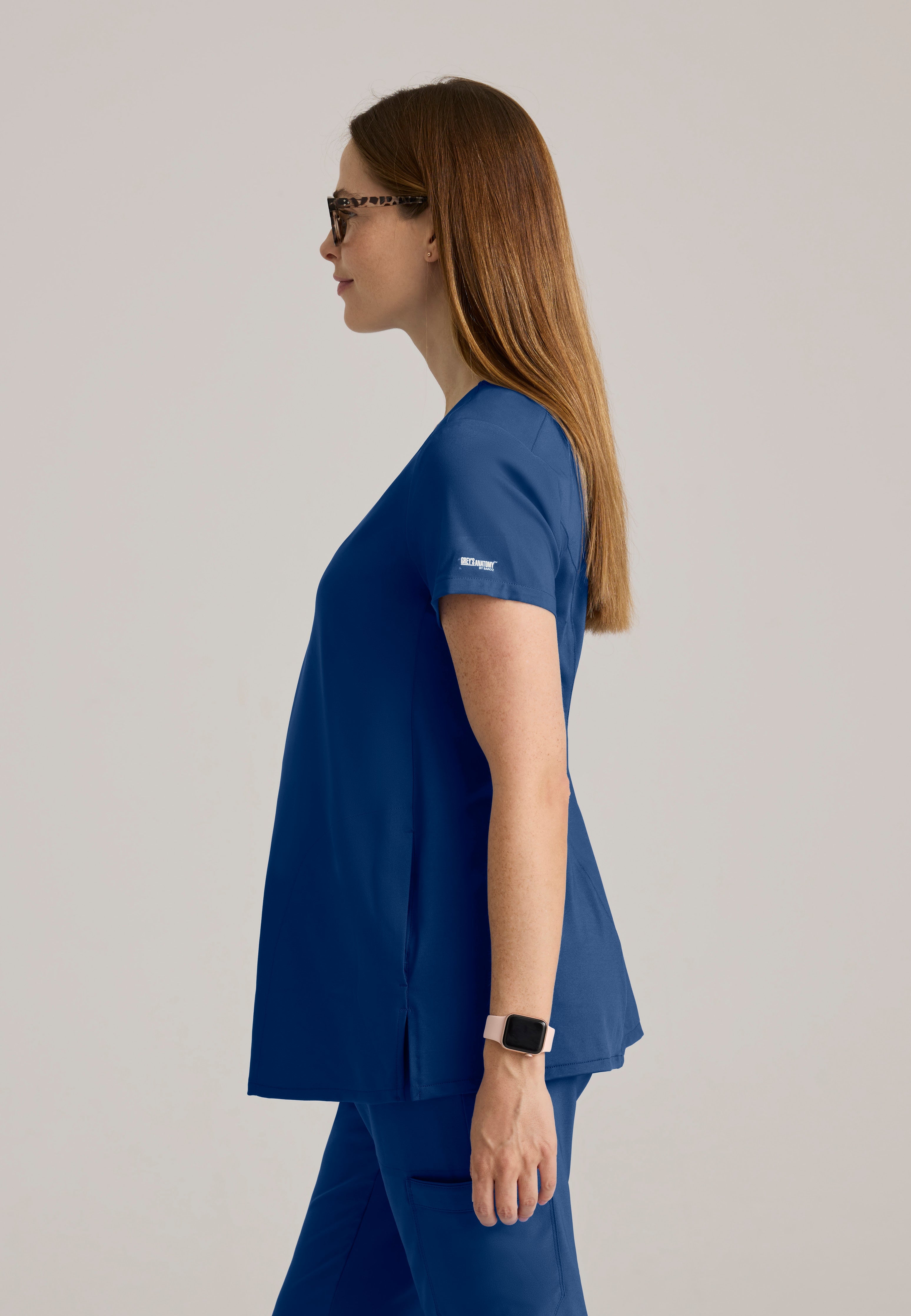 Side View of the Promise Maternity Top in Indigo from Grey's Anatomy™ by Barco Evolve