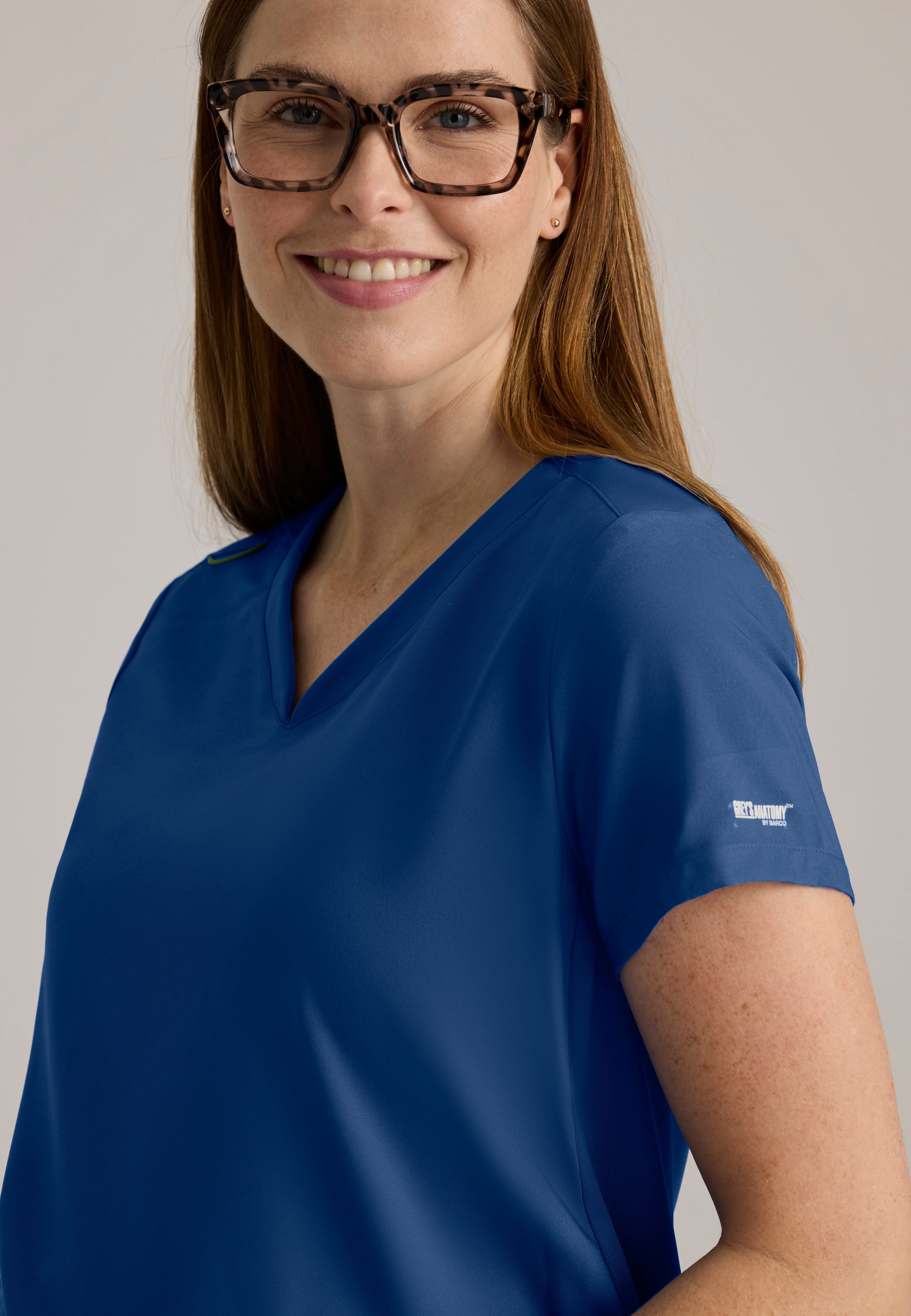 Detail Shot of the Promise Maternity Top in Indigo from Grey's Anatomy™ by Barco Evolve
