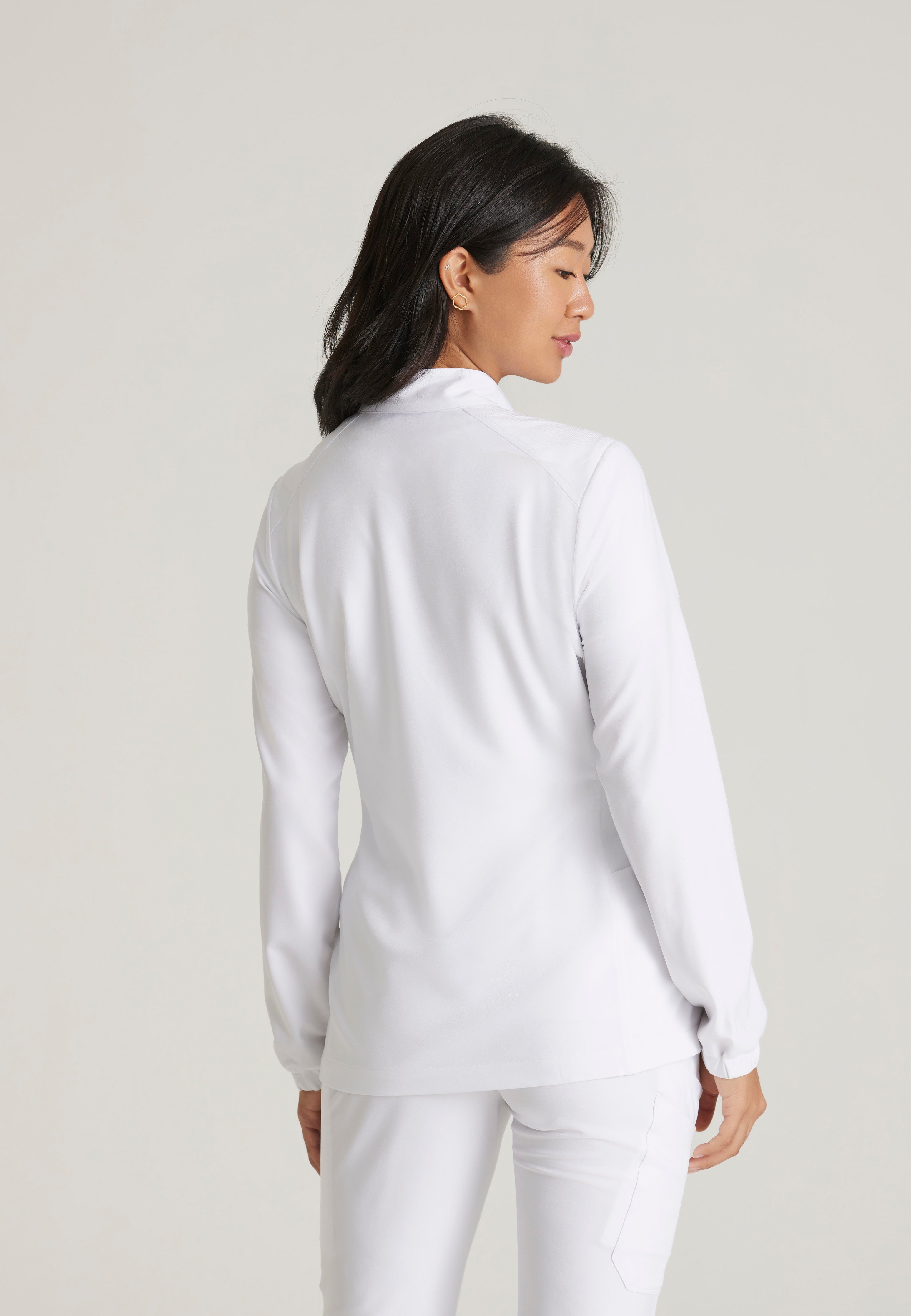 Back View of the Virtue 3-Pocket Stand-Up Collar Ciclo® Scrub Jacket in White from Grey's Anatomy™ by Barco Evolve