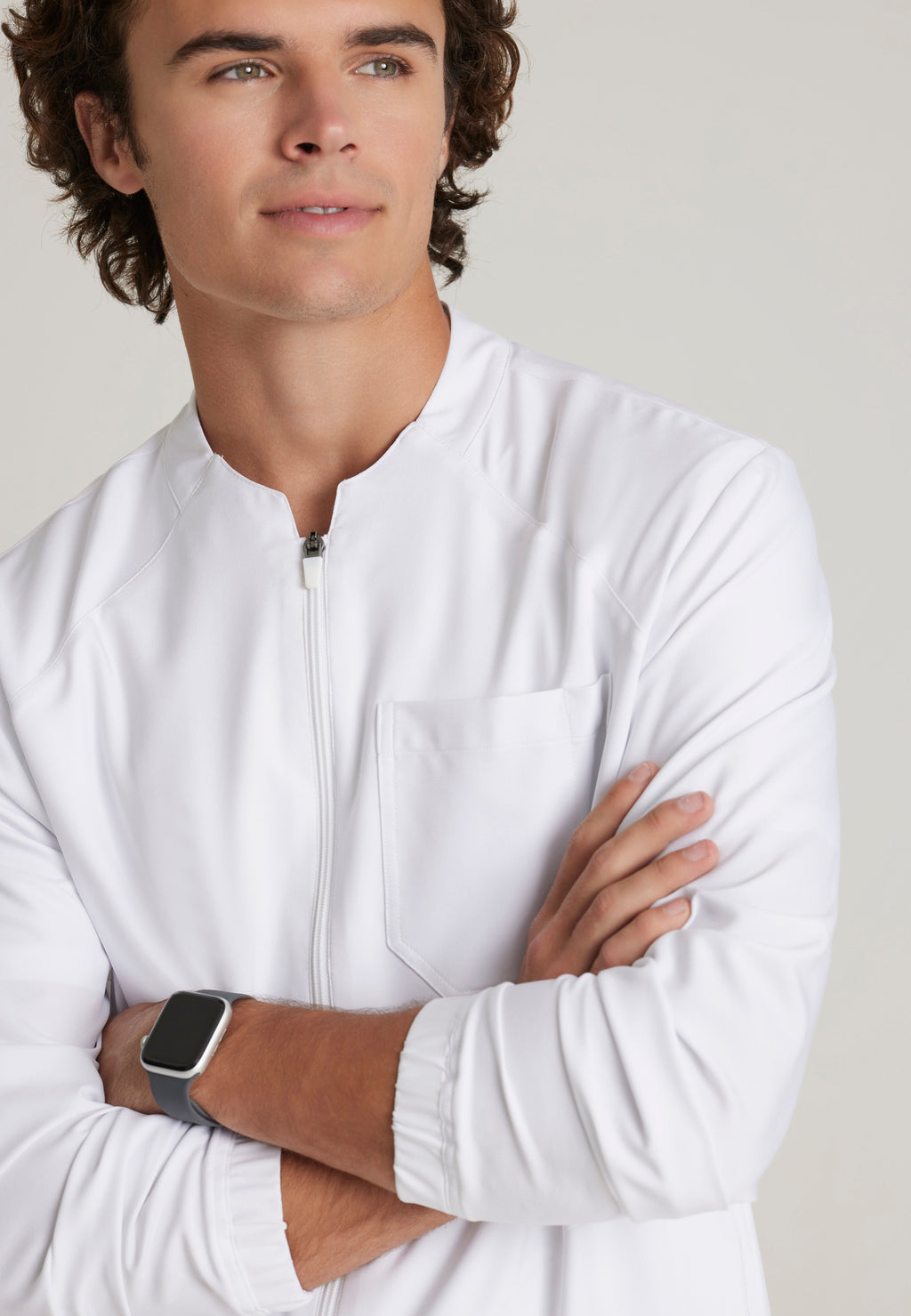 Detail Shot of the Cycle 3-Pocket Crewneck Ciclo® Scrub Jacket in White from Grey's Anatomy™ by Barco Evolve