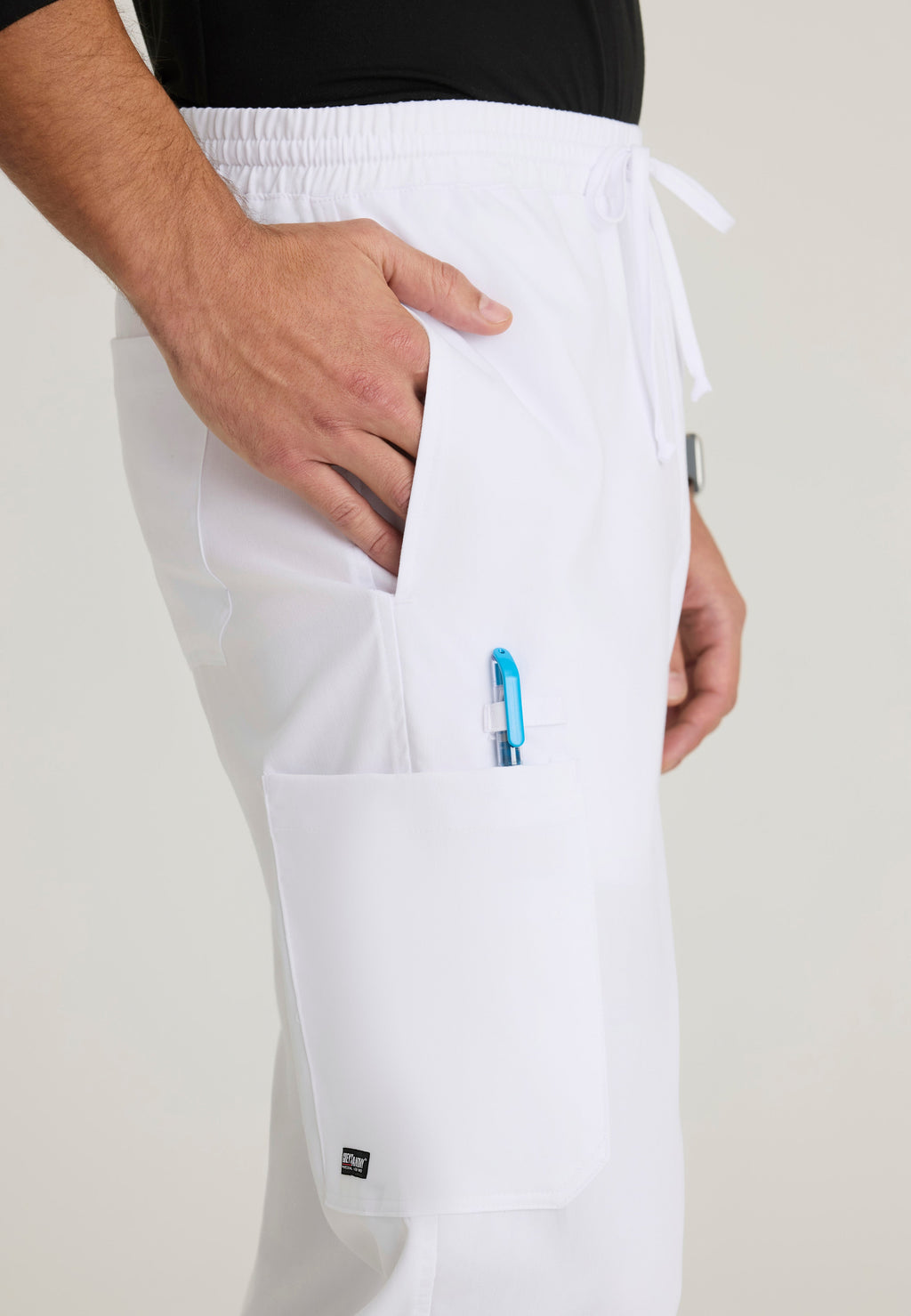 Detail Shot of the Evan 5-Pocket Zip-Fly Scrub Pant in White from Grey's Anatomy™ by Barco Classic