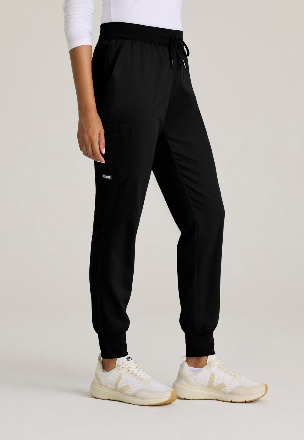 Side View of the Finley 6-Pocket Knit Waistband Jogger in Black from Grey's Anatomy™ by Barco Classic