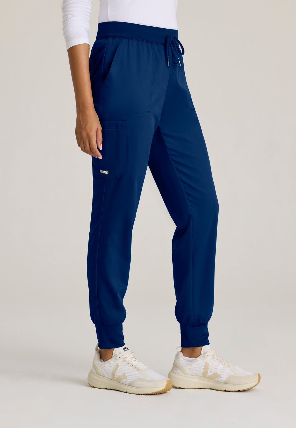 Side View of the Finley 6-Pocket Knit Waistband Jogger in Indigo from Grey's Anatomy™ by Barco Classic