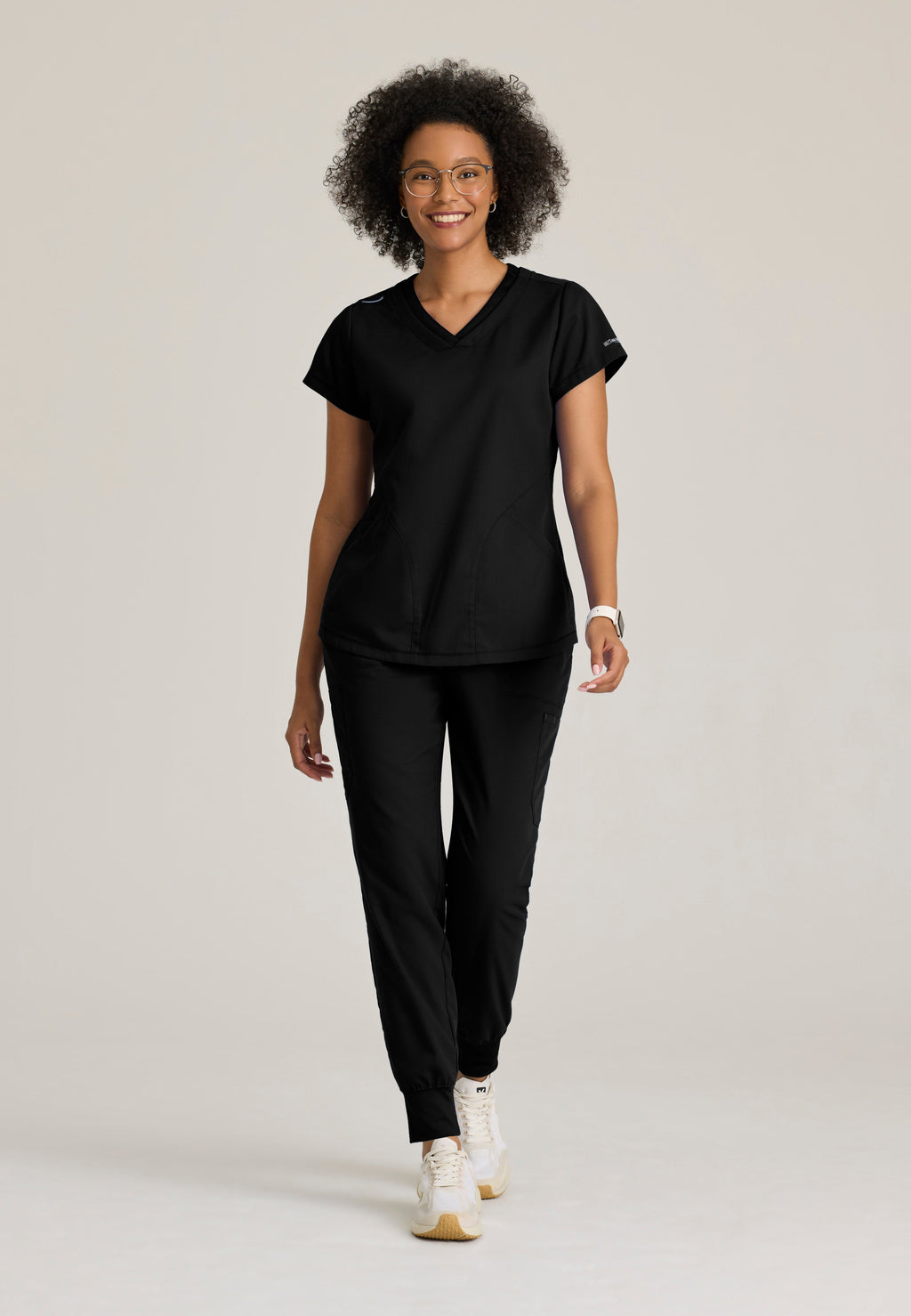 Full Body View of the Evelyn Pintuck Detail Scrub Top in Black from Grey's Anatomy™ by Barco Classic