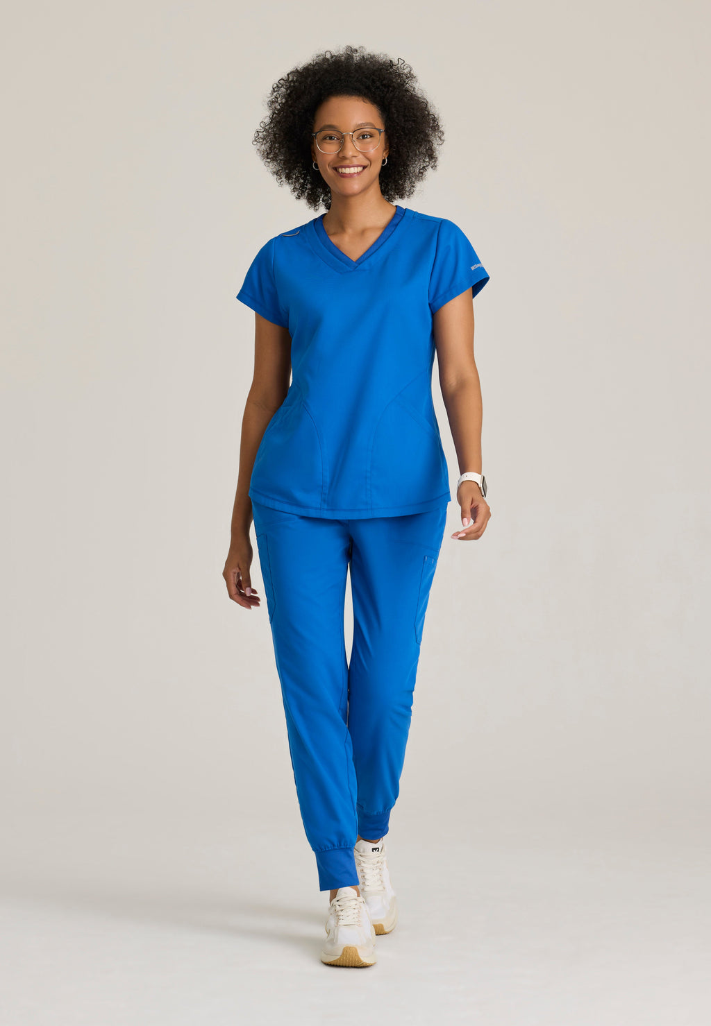 Full Body View of the Evelyn Pintuck Detail Scrub Top in New Royal from Grey's Anatomy™ by Barco Classic