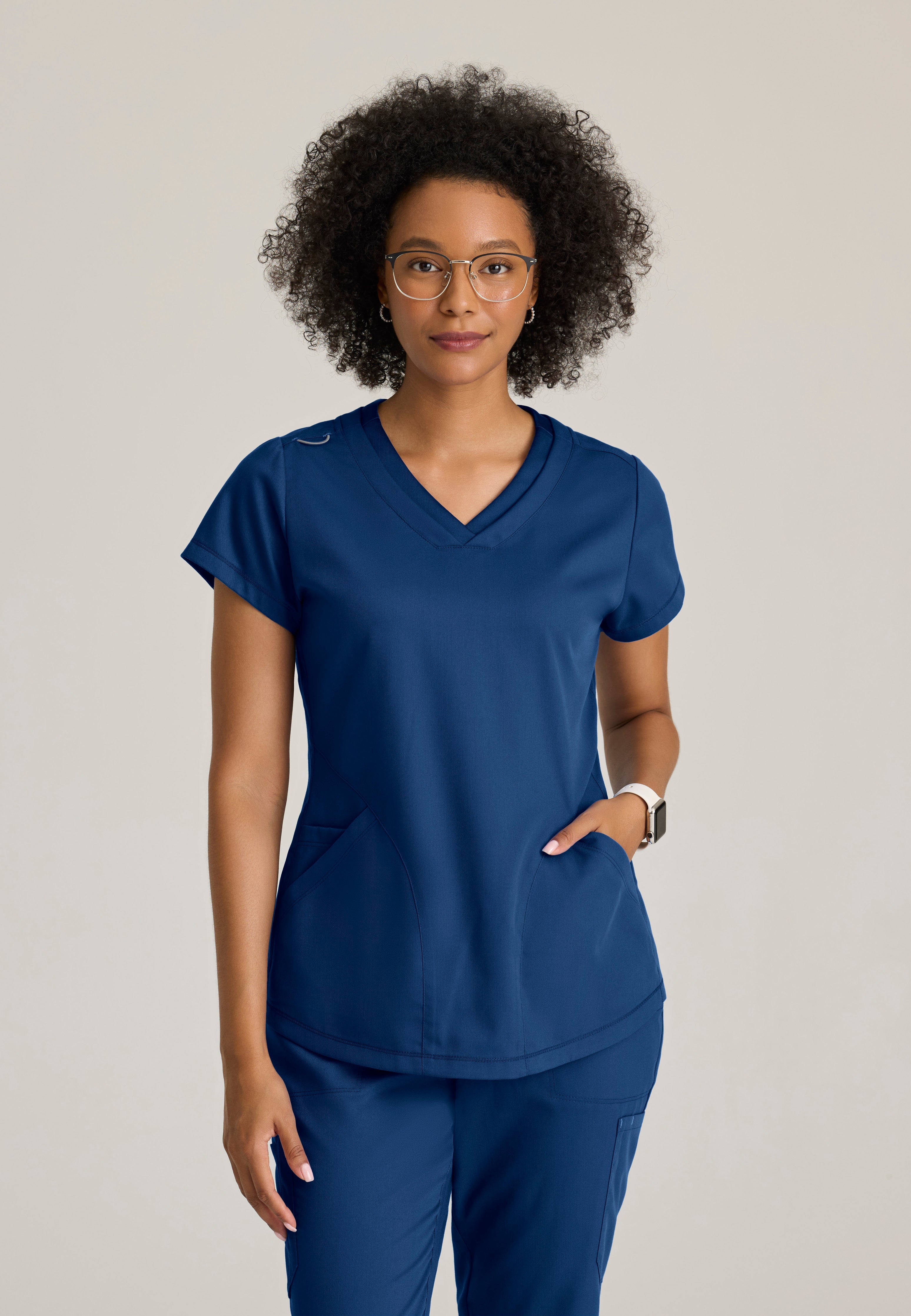 Front View of the Evelyn Pintuck Detail Scrub Top in Indigo from Grey's Anatomy™ by Barco Classic
