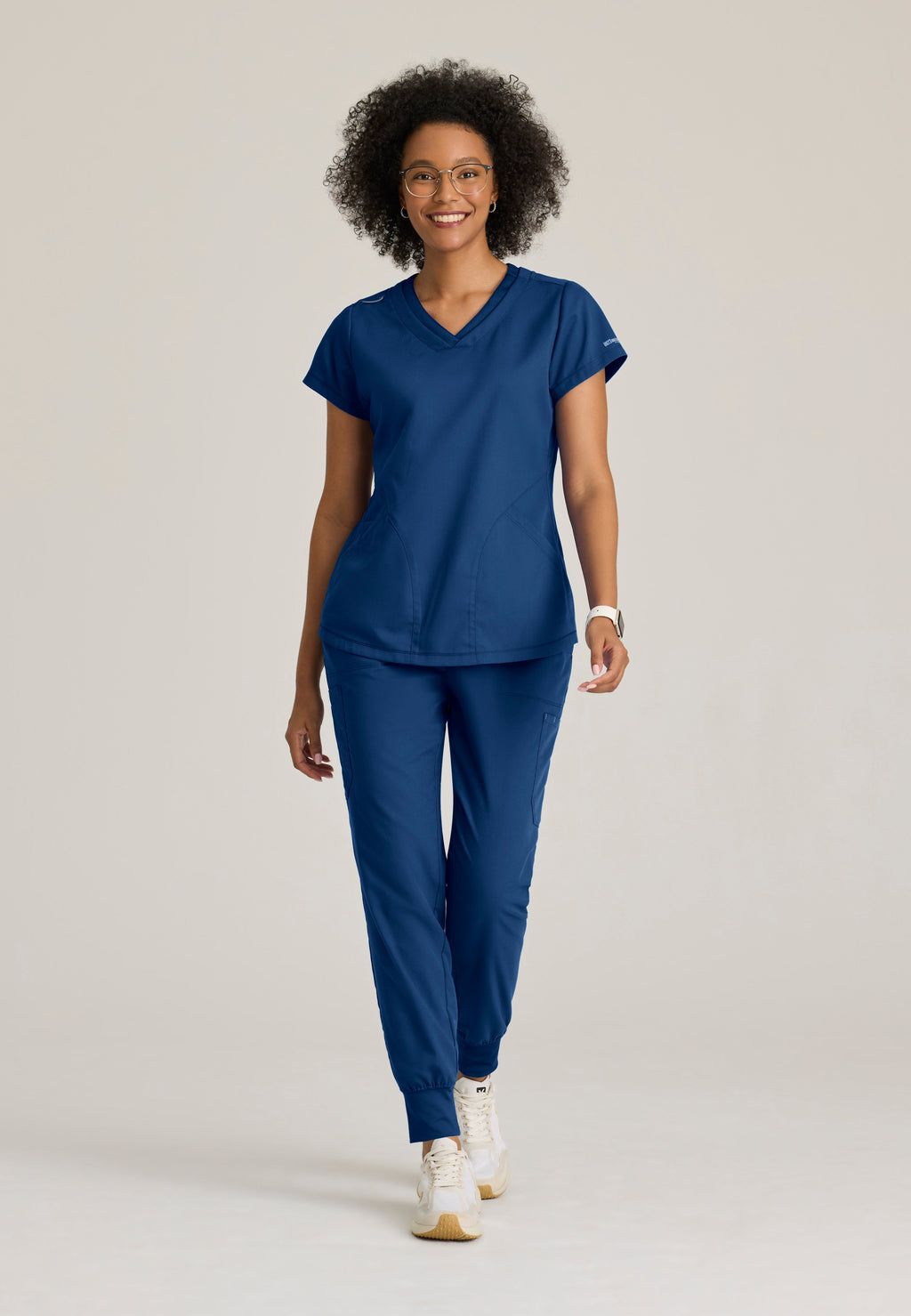 Full Body View of the Evelyn Pintuck Detail Scrub Top in Indigo from Grey's Anatomy™ by Barco Classic